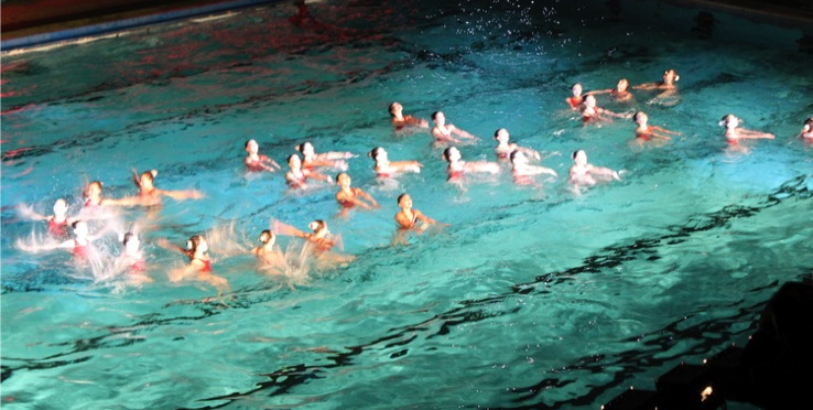CNC spelled out in synchronized swimmers. Obviously.