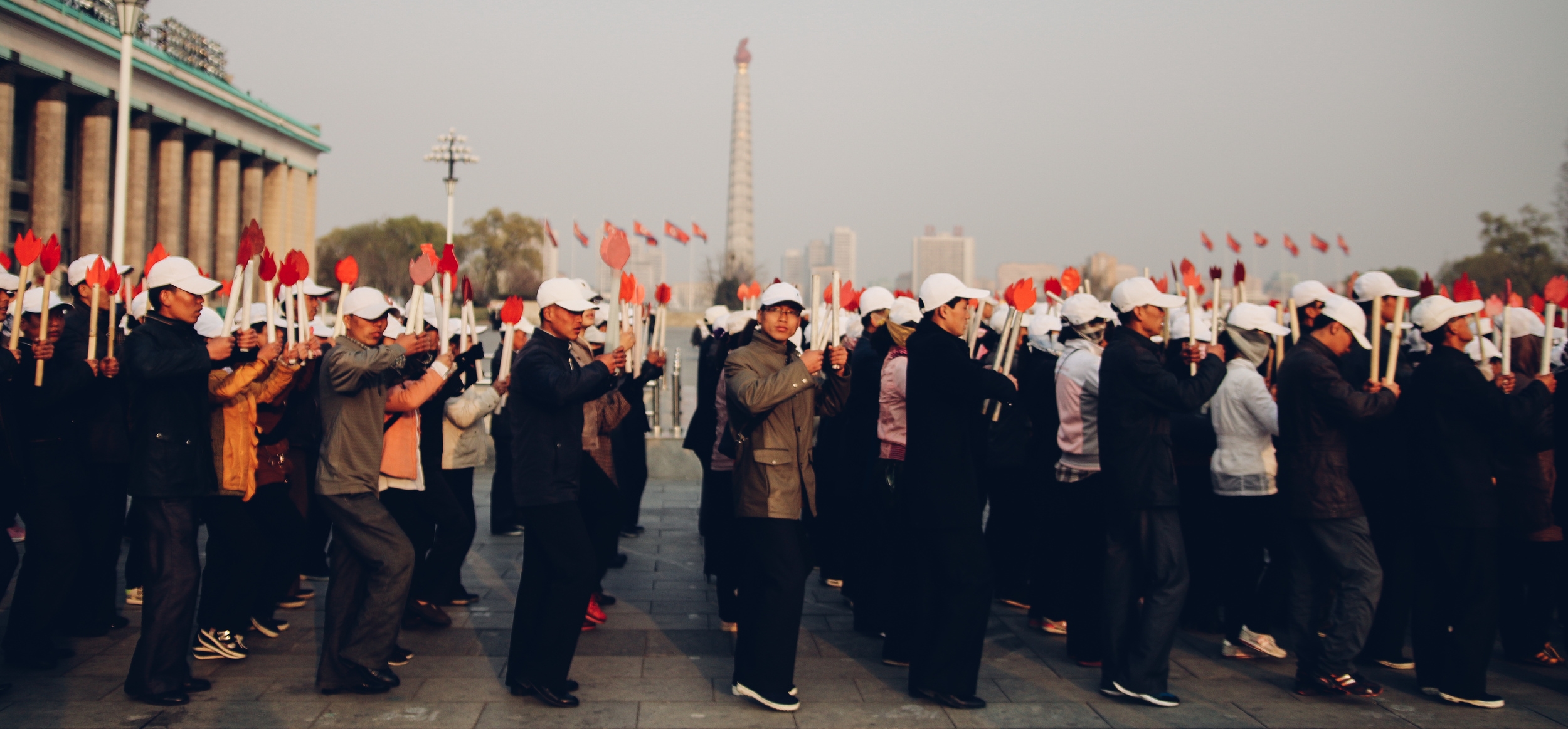 Practicing in Kim Il Sung Square for a torch parade. Photo by Joe Han