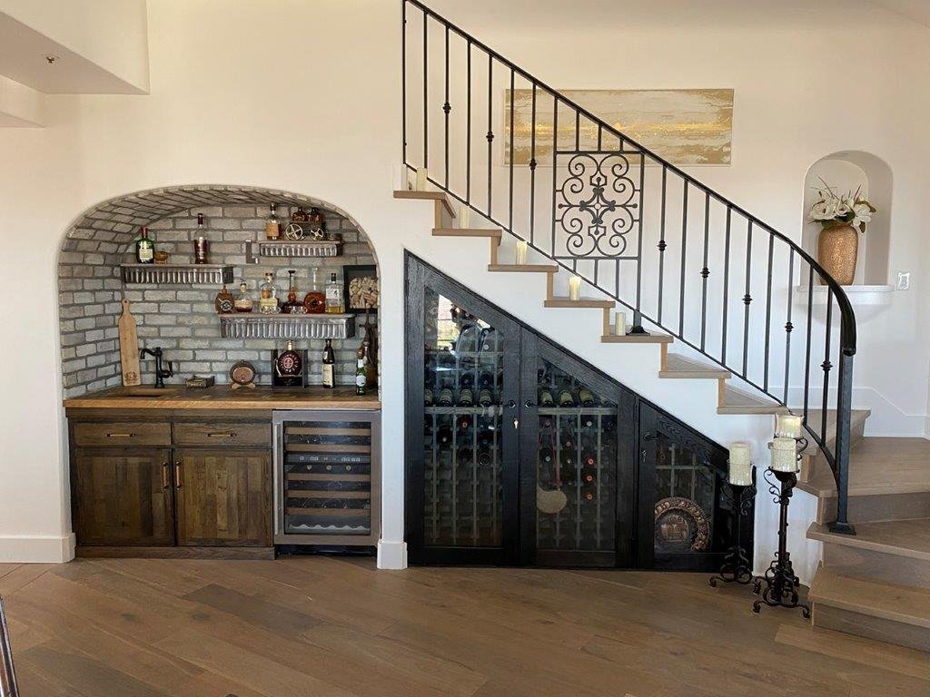 under stairs wine cabinet and kitchen counter designed by Gabriel McKeagney