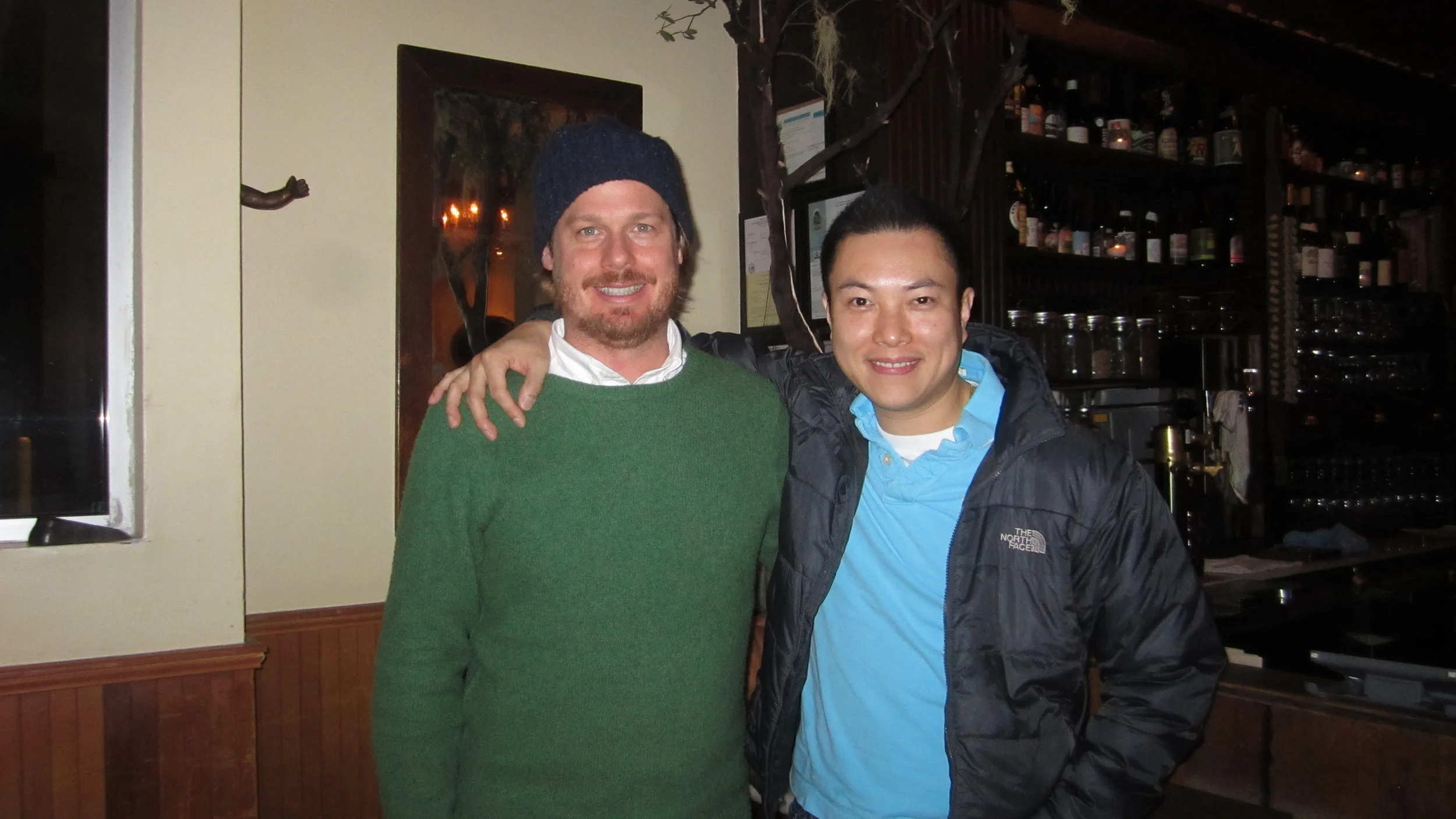 Jason Kirmse (left) & Cyrick Hia (right) - owners of Fat Angel posing in front of their bar.
