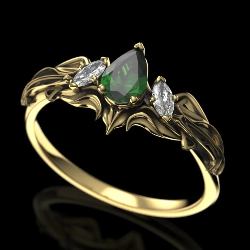 05-elven-emerald-engagement-ring-three-quarter.jpg