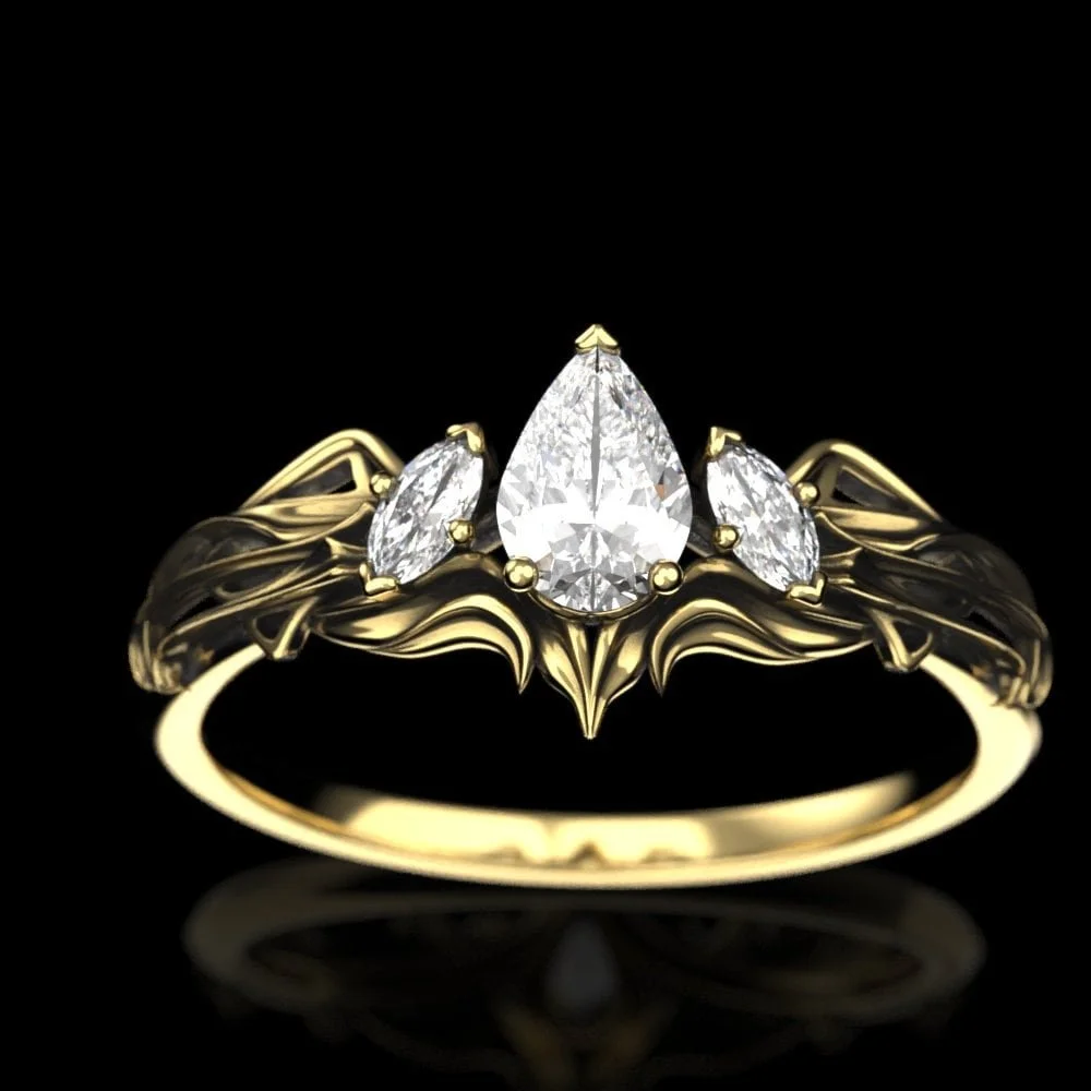 06-gold-art-nouveau-pear-moissanite-engagem-worn.jpg