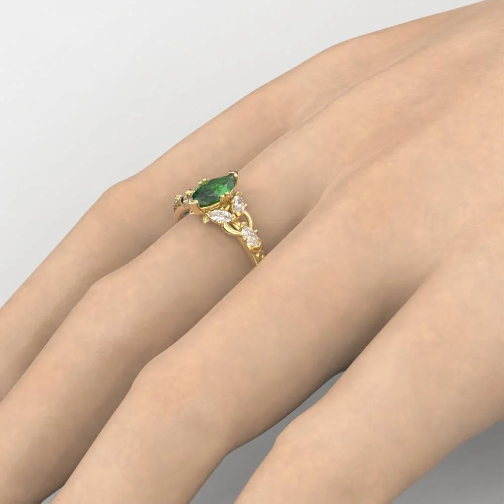 04-gold-elvish-engagement-ring-lab-emerald-side.jpg