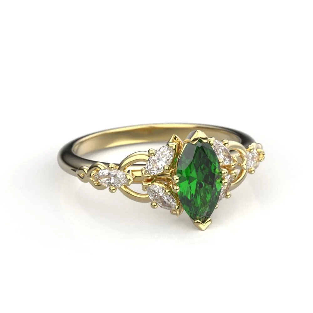 07-gold-elvish-engagement-ring-lab-emerald-lifestyle.jpg