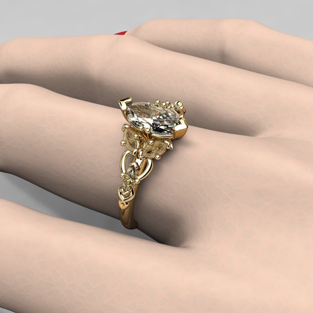10-gold-elvish-moissanite-engagement-ring-f-scale.jpg