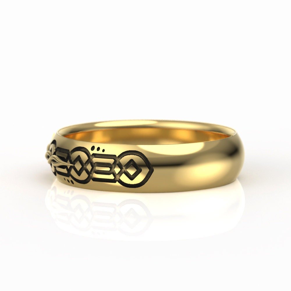 06-gold-engraved-celtic-wedding-band-5mm-sq-worn.jpg