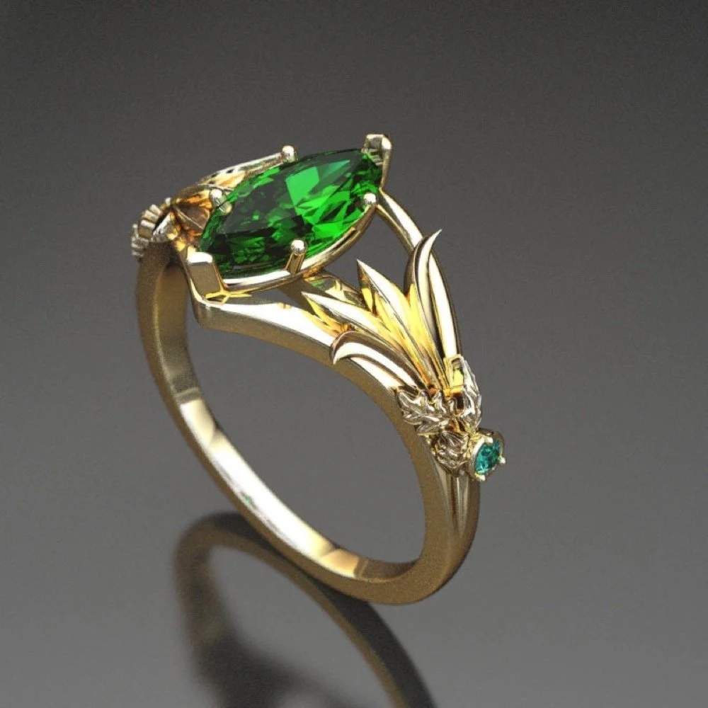 04-gold-leaf-lab-emerald-engagement-ring-el-side.jpg