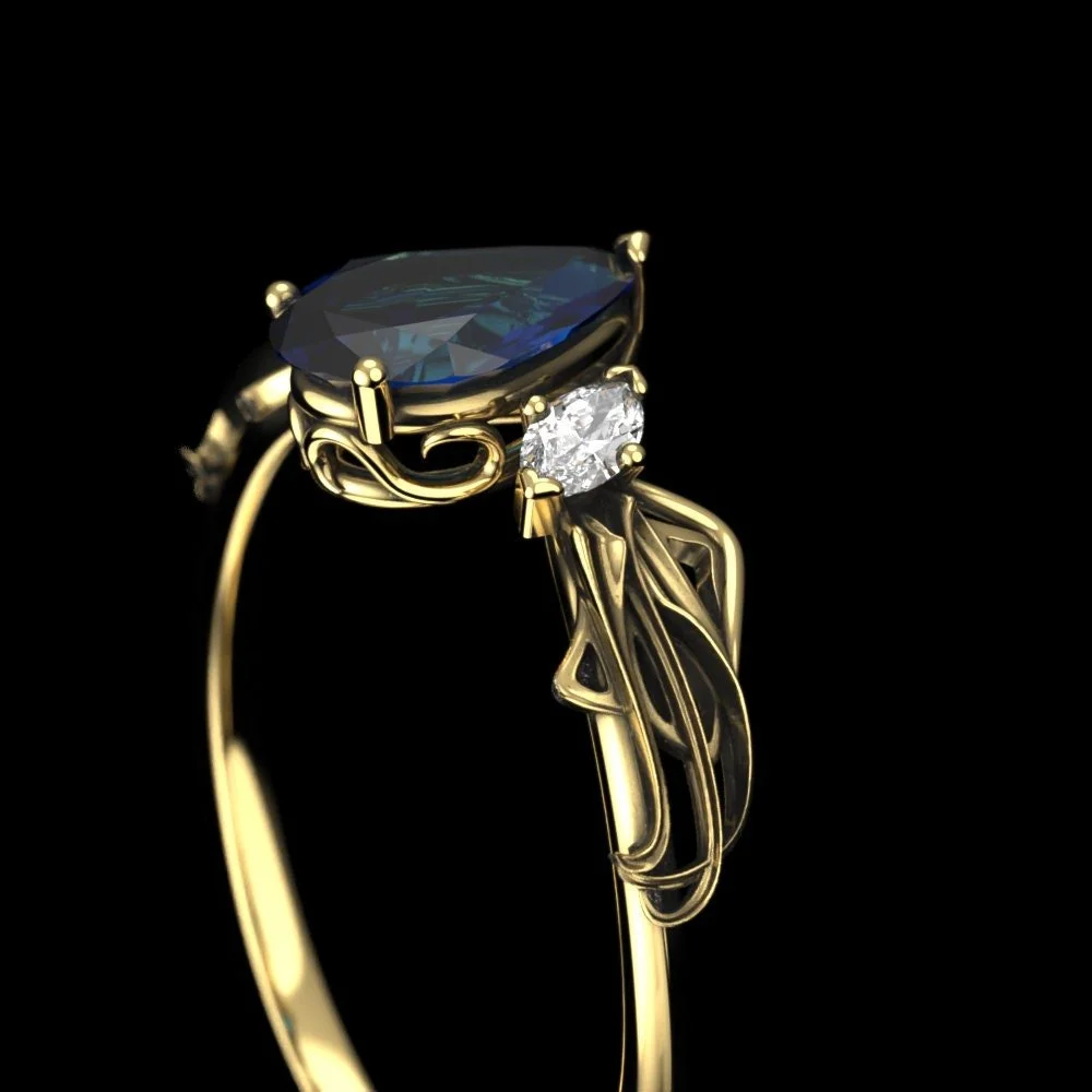 05-gold-pear-cut-lab-sapphire-engagement-ri-three-quarter.jpg
