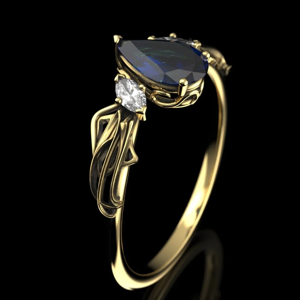 07-gold-pear-cut-lab-sapphire-engagement-ri-lifestyle.jpg