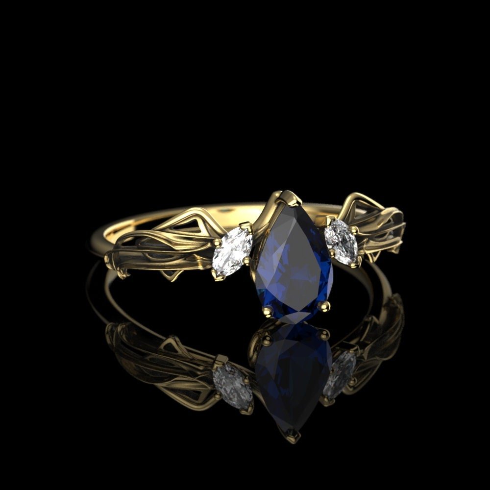 09-gold-pear-cut-lab-sapphire-engagement-ri-alternate.jpg
