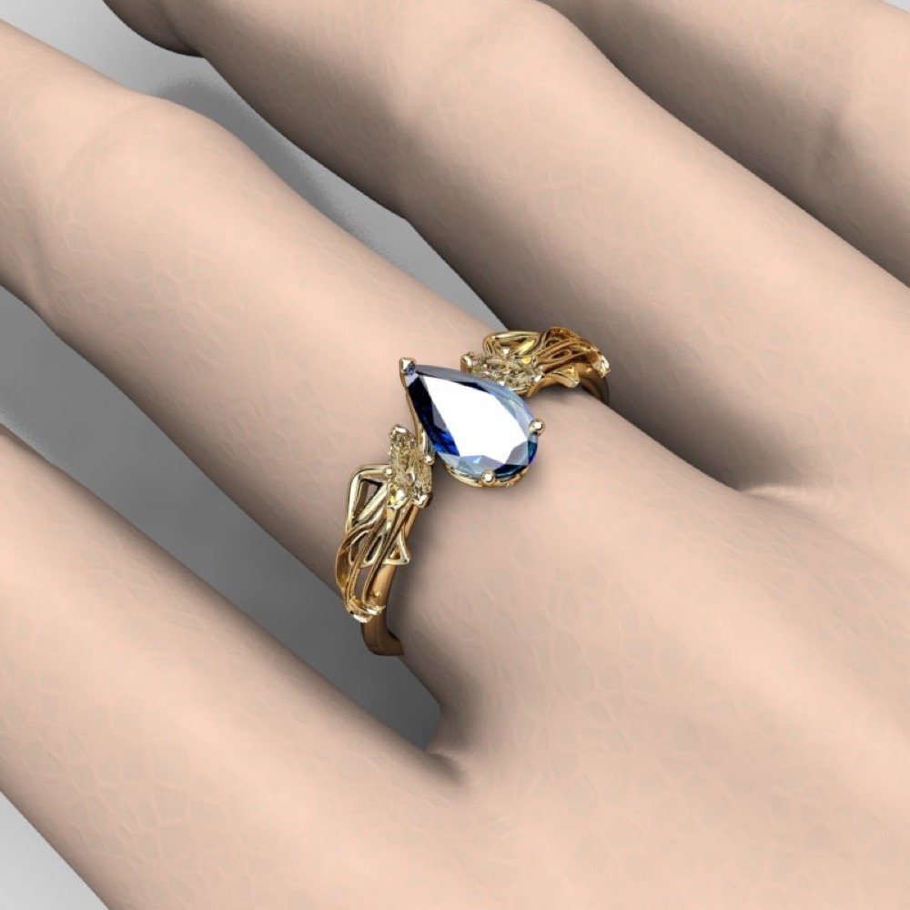 10-gold-pear-cut-lab-sapphire-engagement-ri-scale.jpg