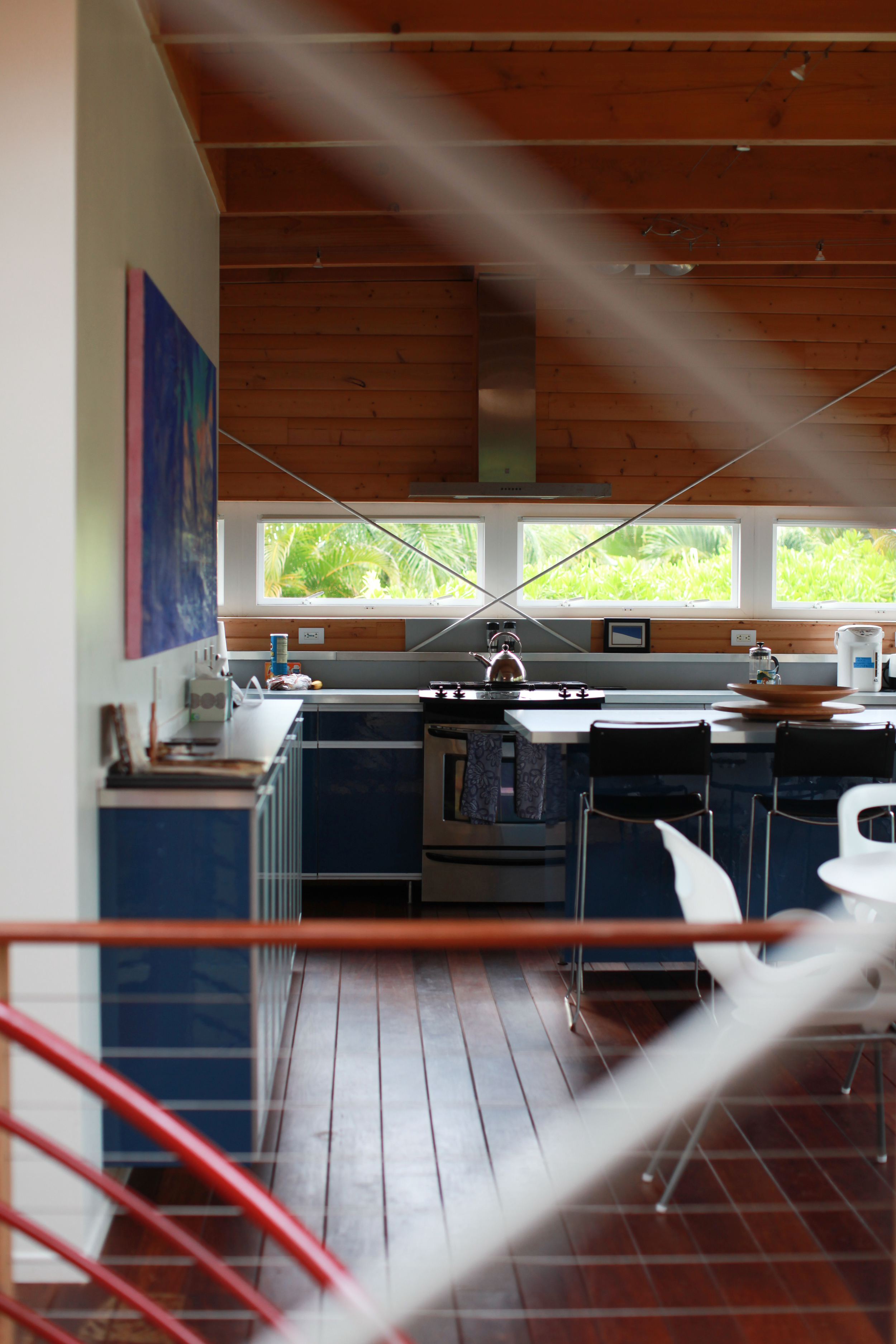 View across the atrium from the living room to dining area and kitchen