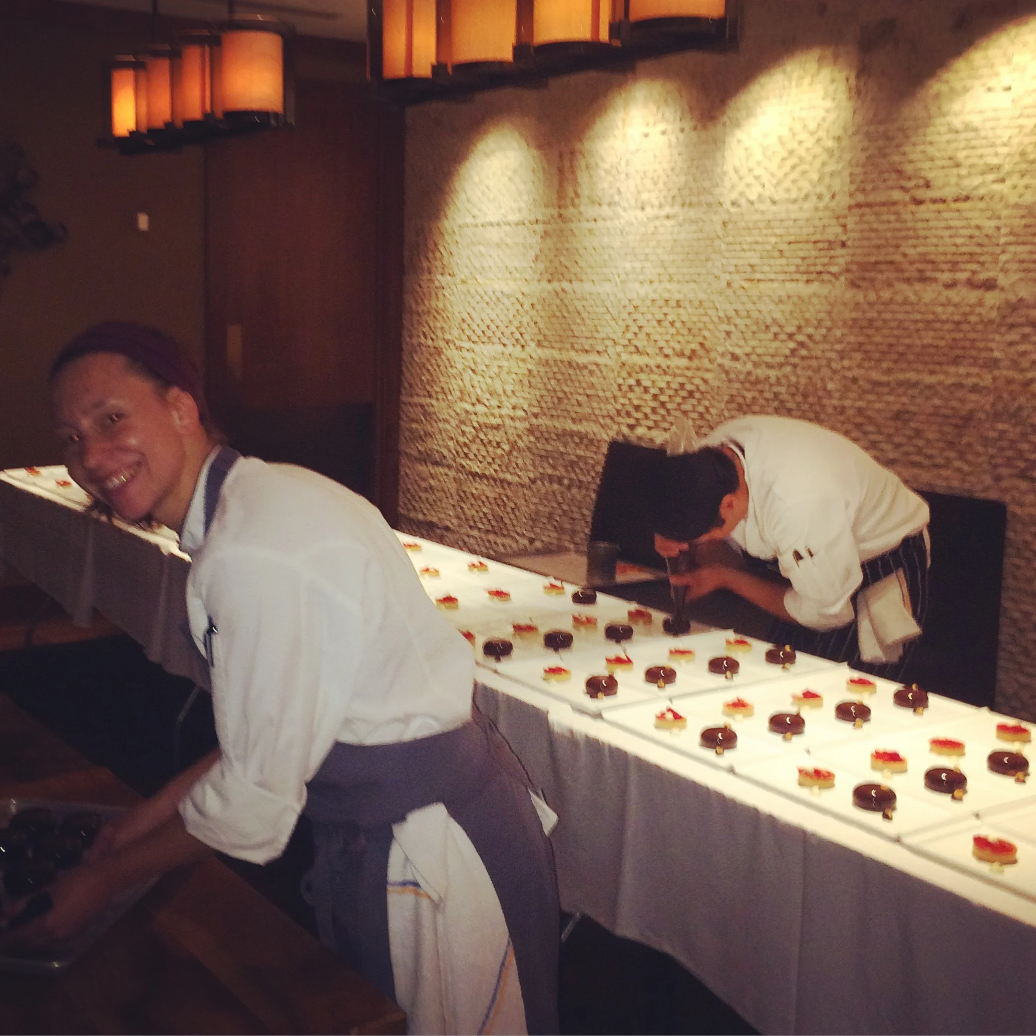 Pastry Chef at Ritz-Carlton plating our desserts