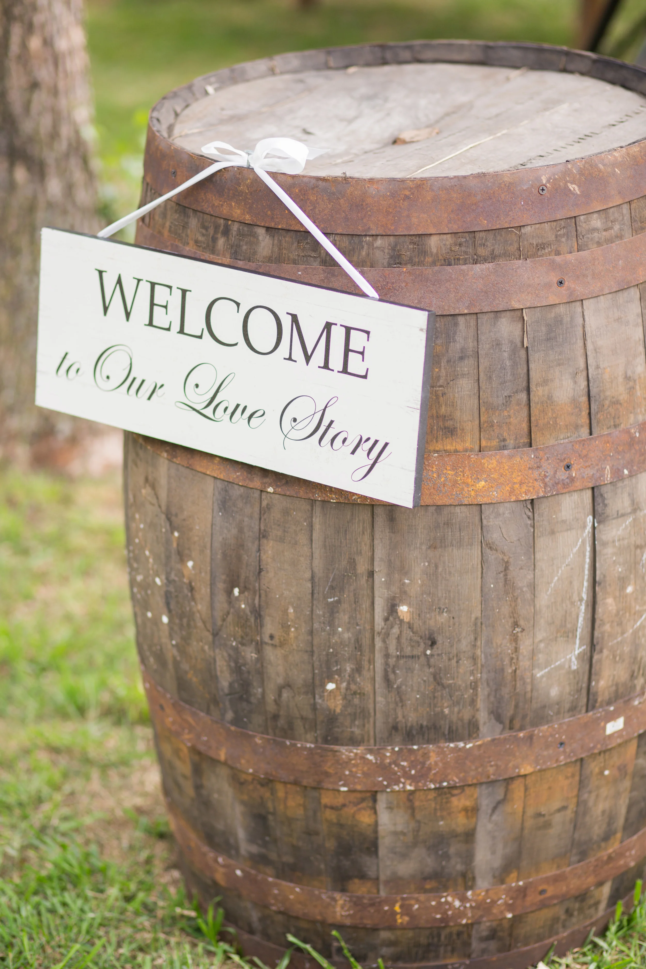 Welcome to our love story sign on barrel