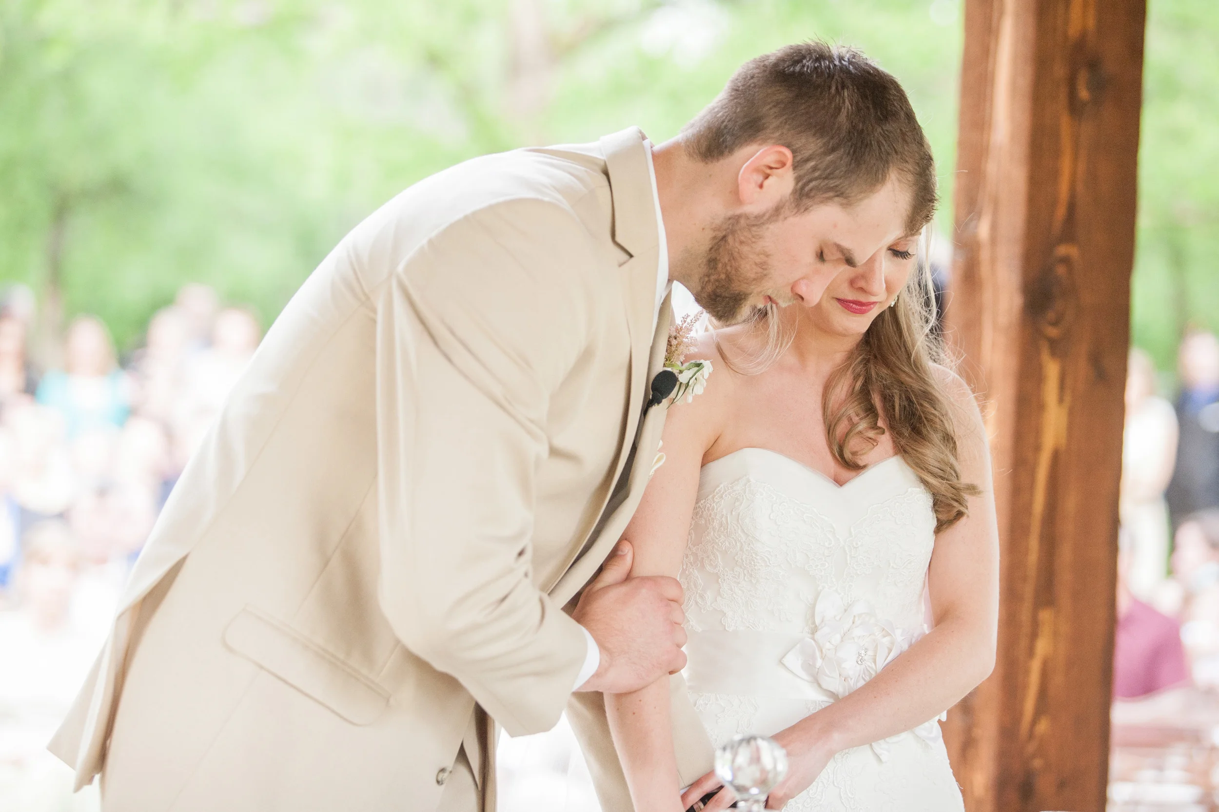 Bride & groom praying during wedding ceremony
