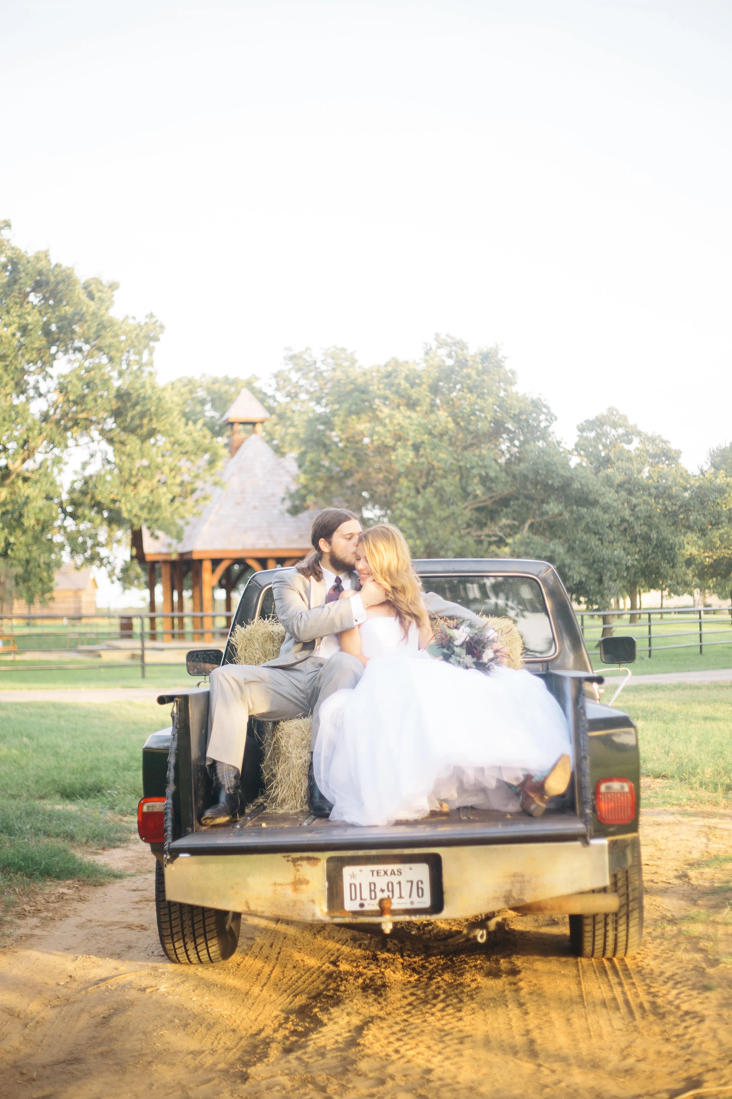 Bride & Groom In back of Old Truck
