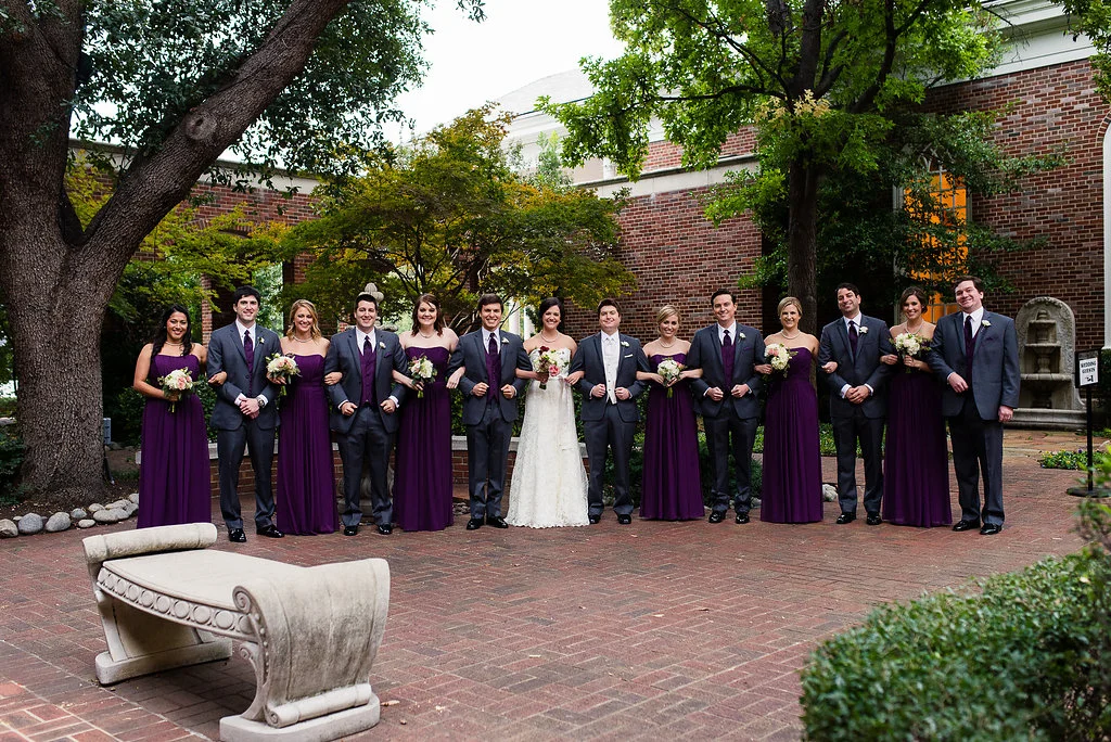 Purple floor-length bridesmaids dresses groomsmen gray suits