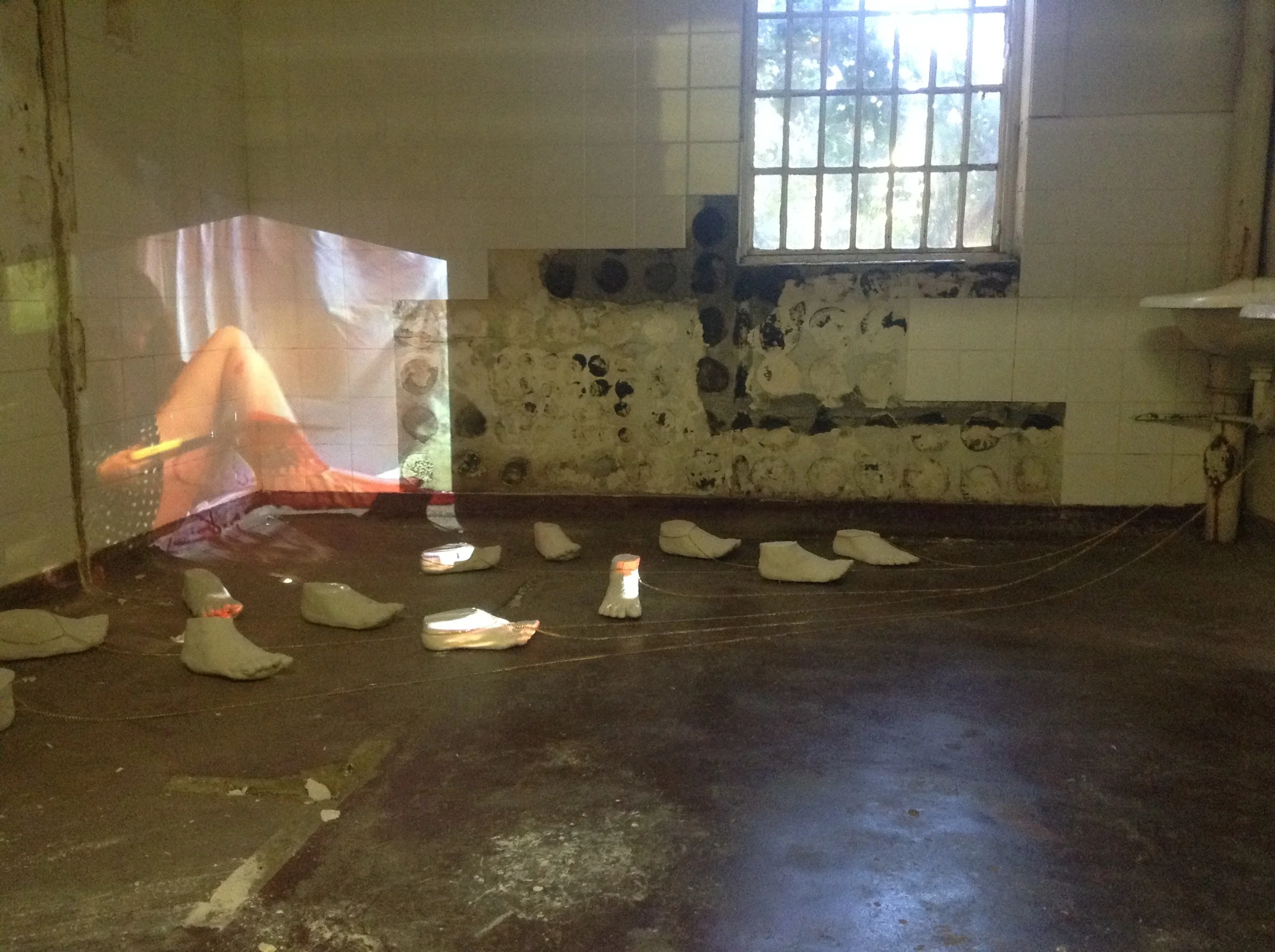  'I Have To Save My Family', Cast feet, gold chain, video projection 