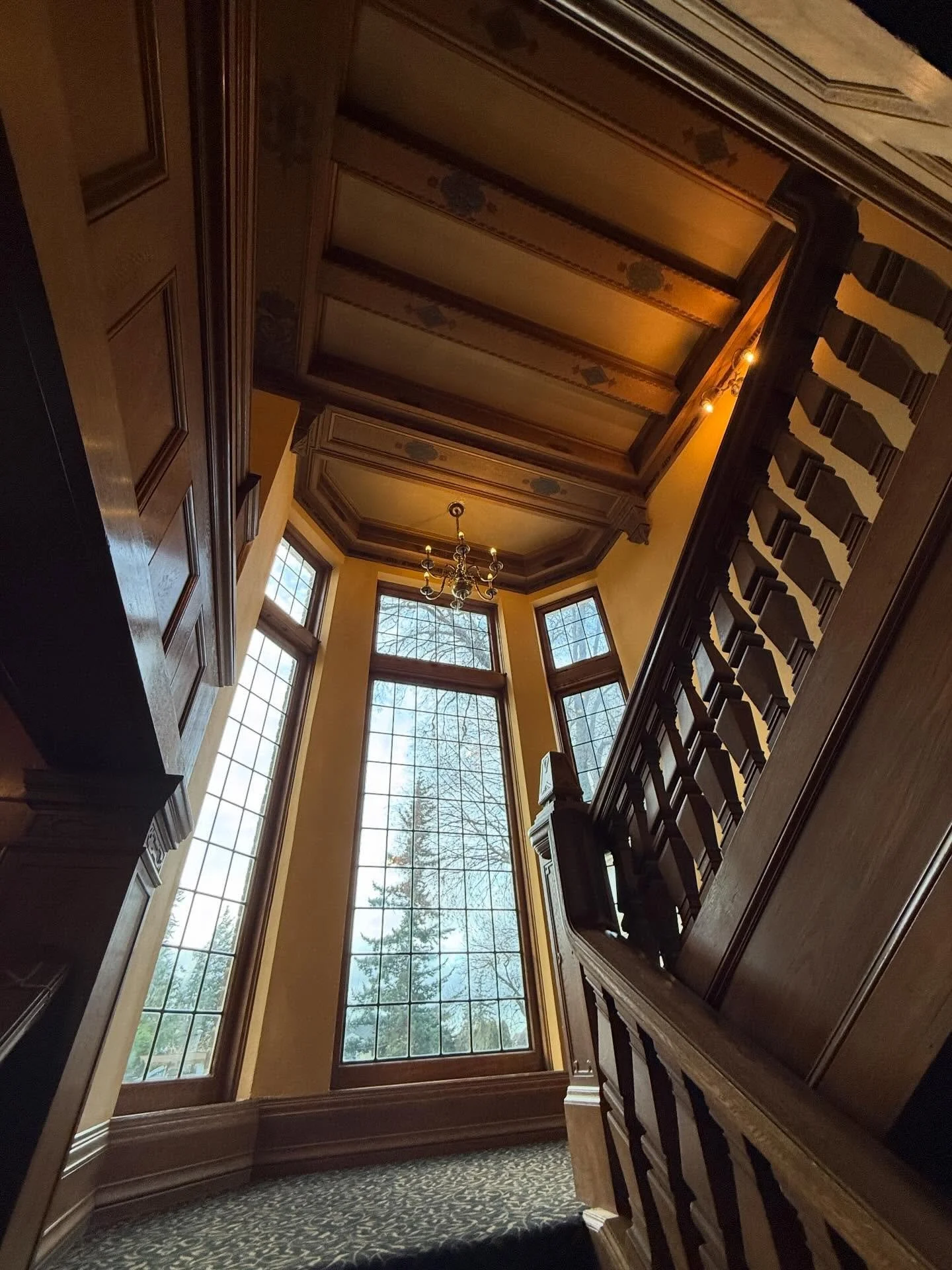Lairmont Manor staircase leading to and from balcony, overlooking the main ballroom ✨