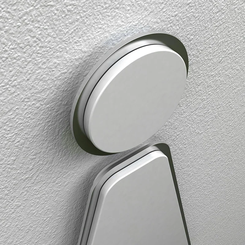 Amenity signage in matte white acrylic, featuring a brushed steel outline.