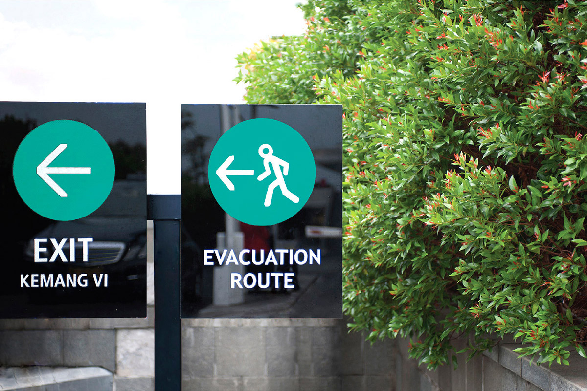 Exterior regulatory signage using polyurethane coated steel bases and back painted glass signs.