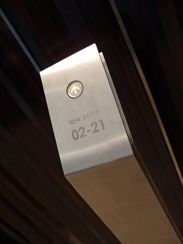 Elevator buttons at ground level.