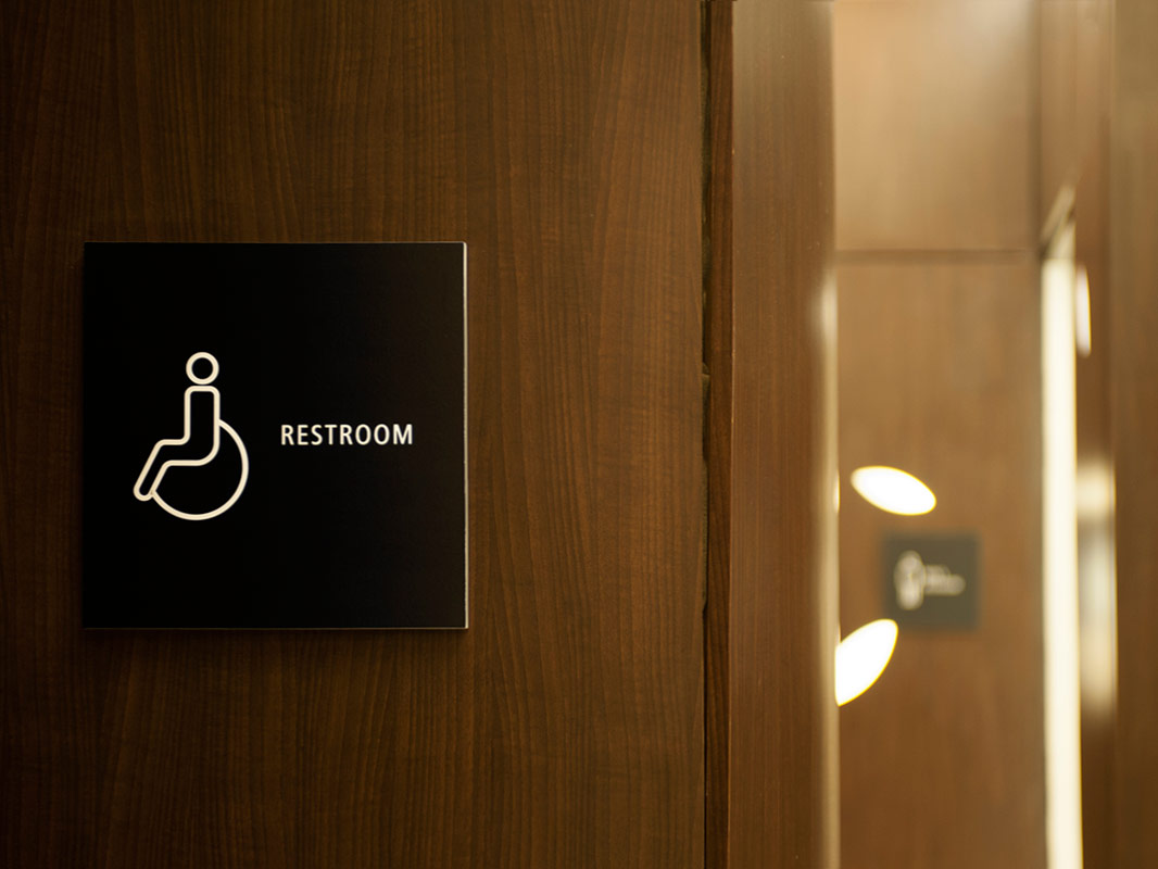 Amenity signage in matte black acrylic.