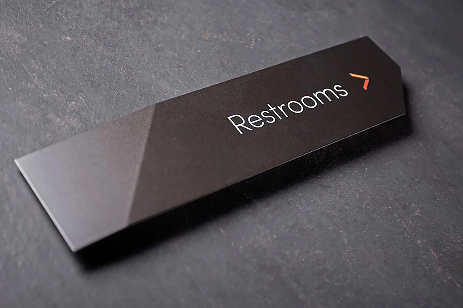 Directional signage, black painted matte alumunium