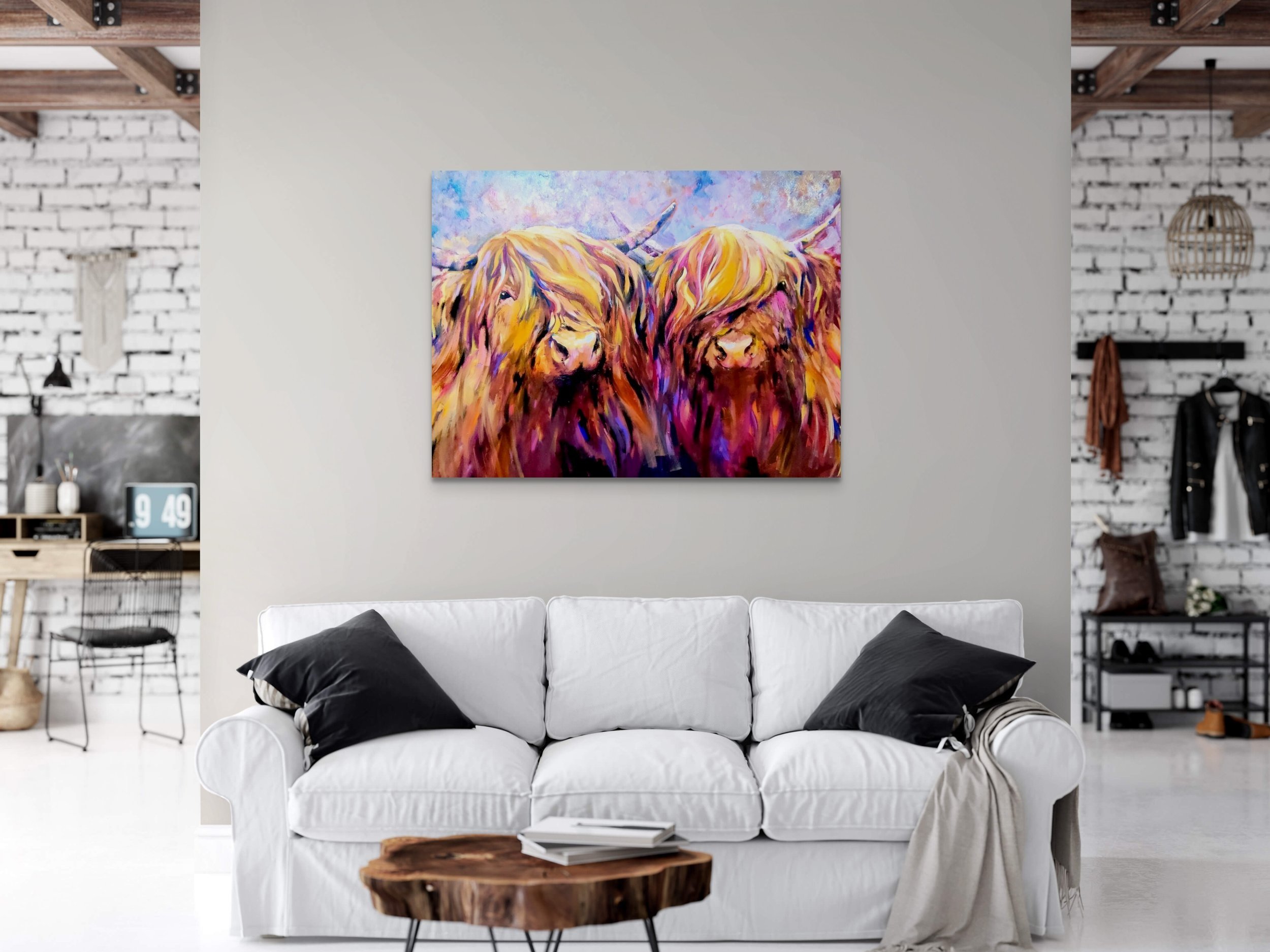 Two highland cows painting on the easel