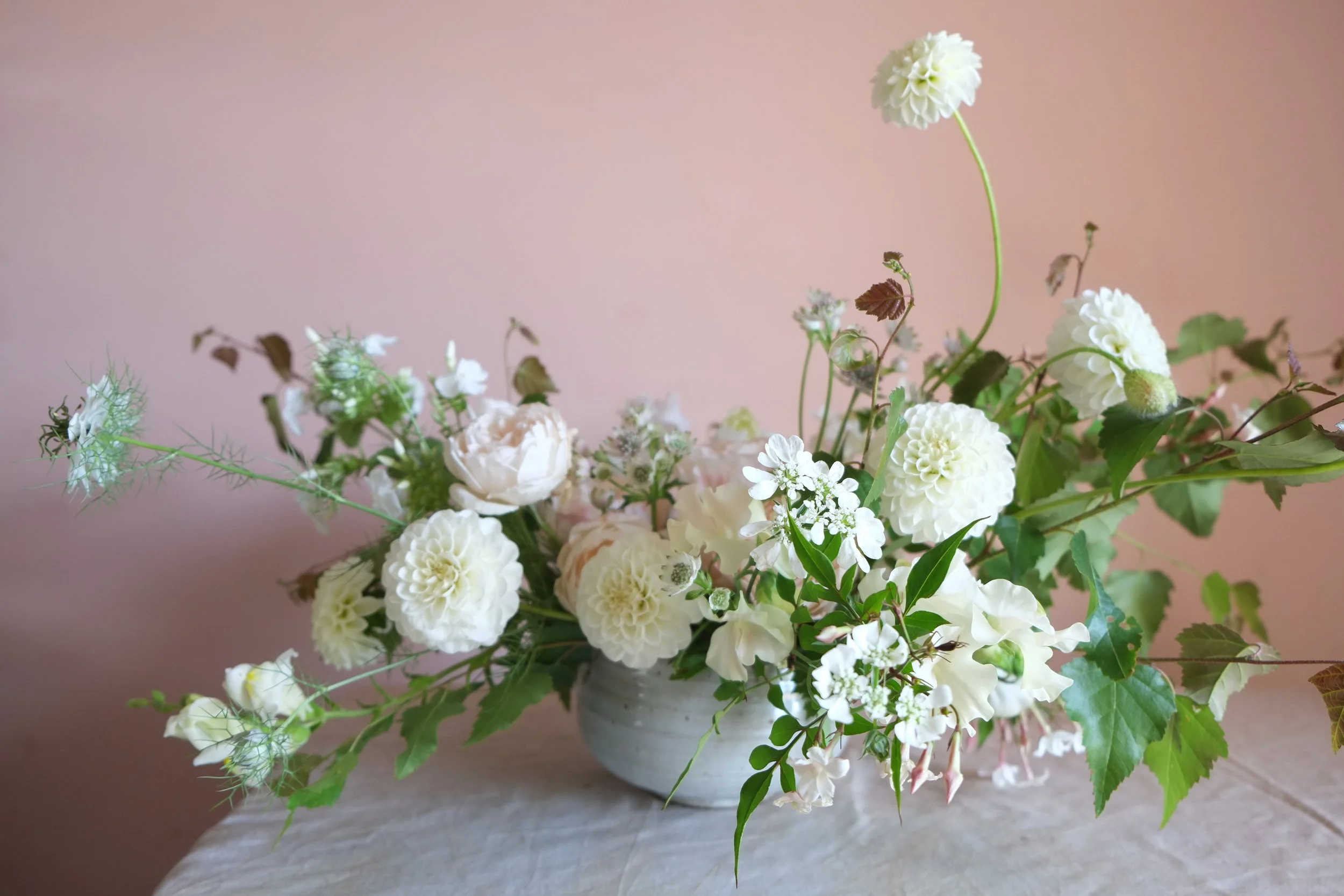 July wedding table inspiration with low bowl arrangement.