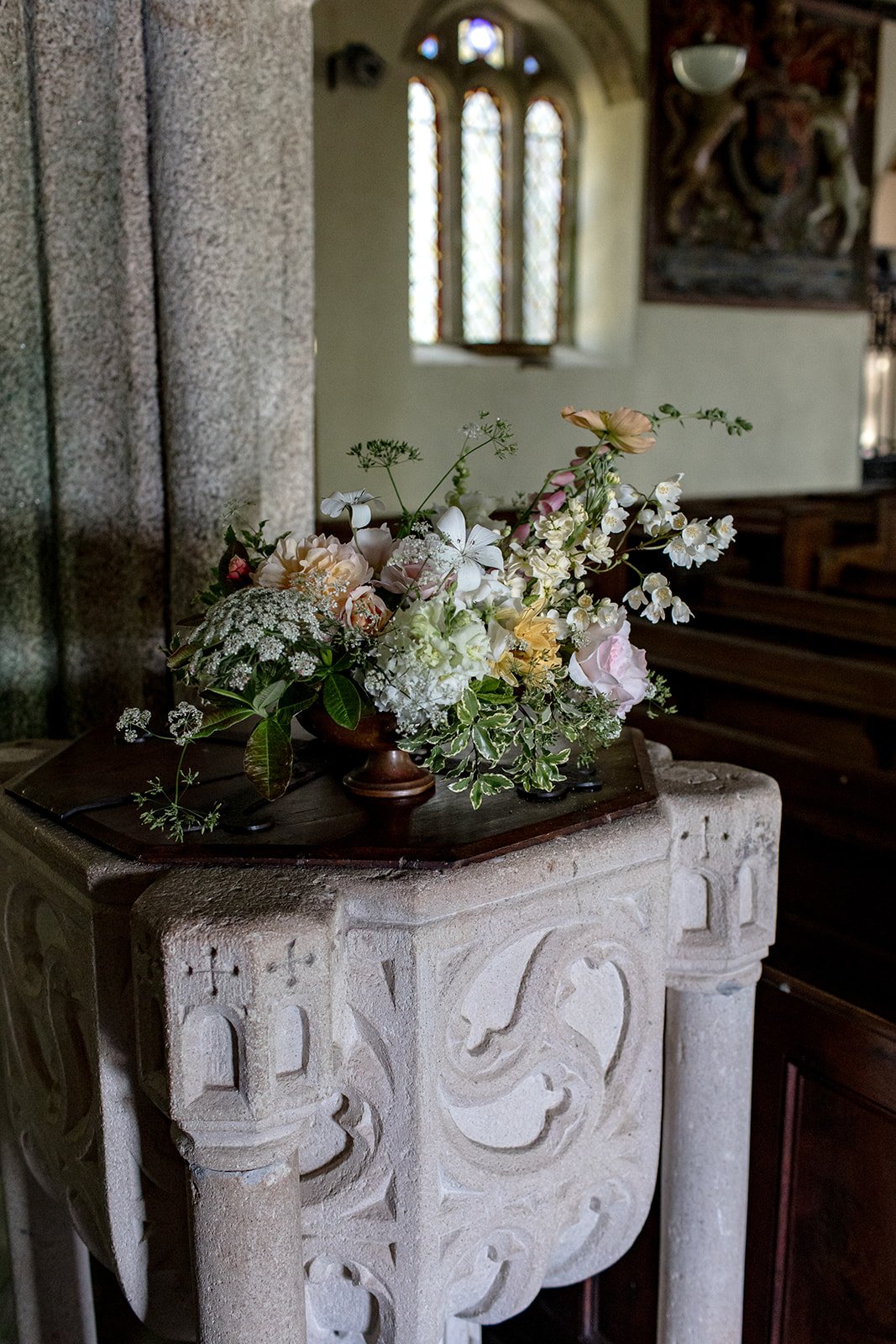Low footed urn of seasonal flowers