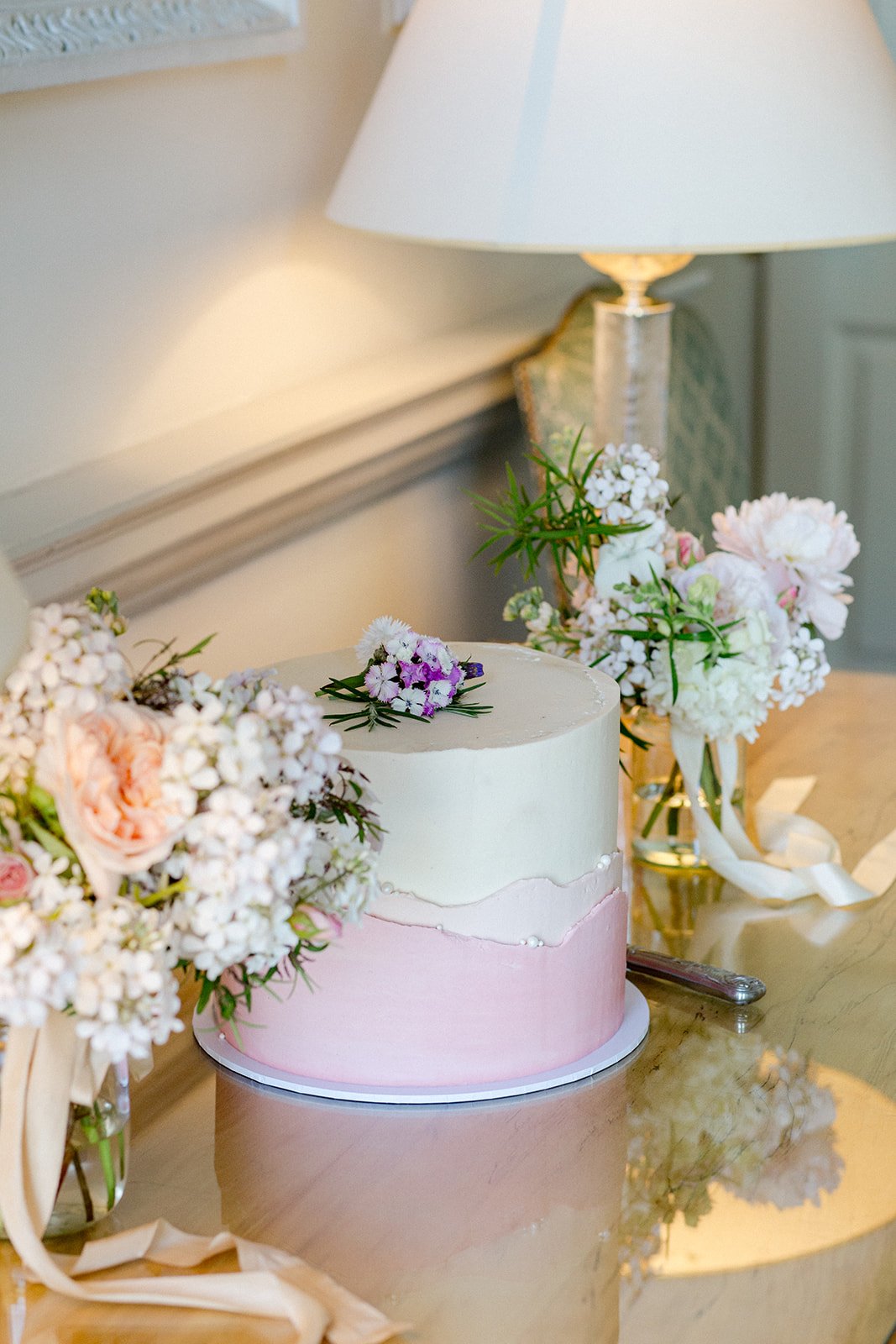 Dressing the cake table with repurposed flowers