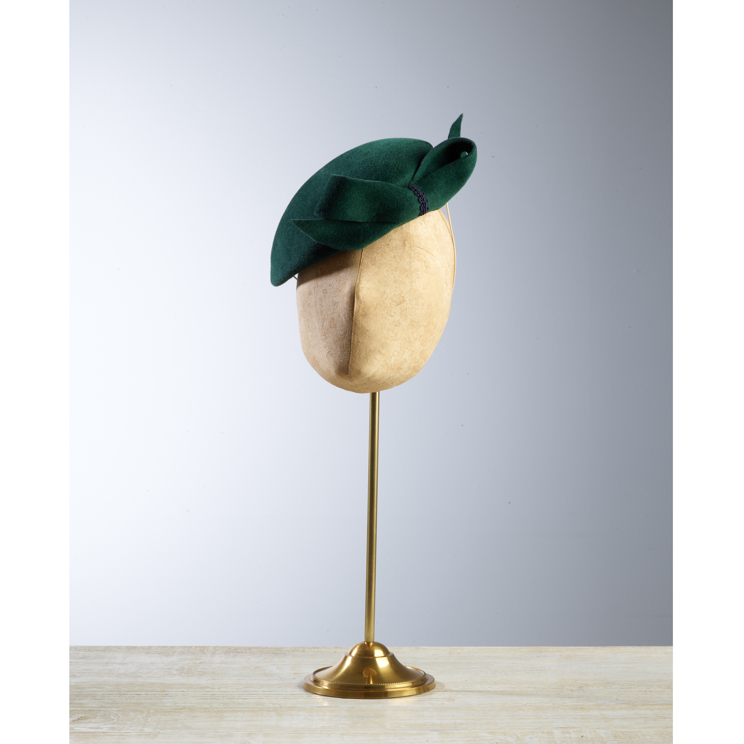 DART Emerald - £75 Emerald peachbloom felt oval headpiece, finished with a bow on the front.