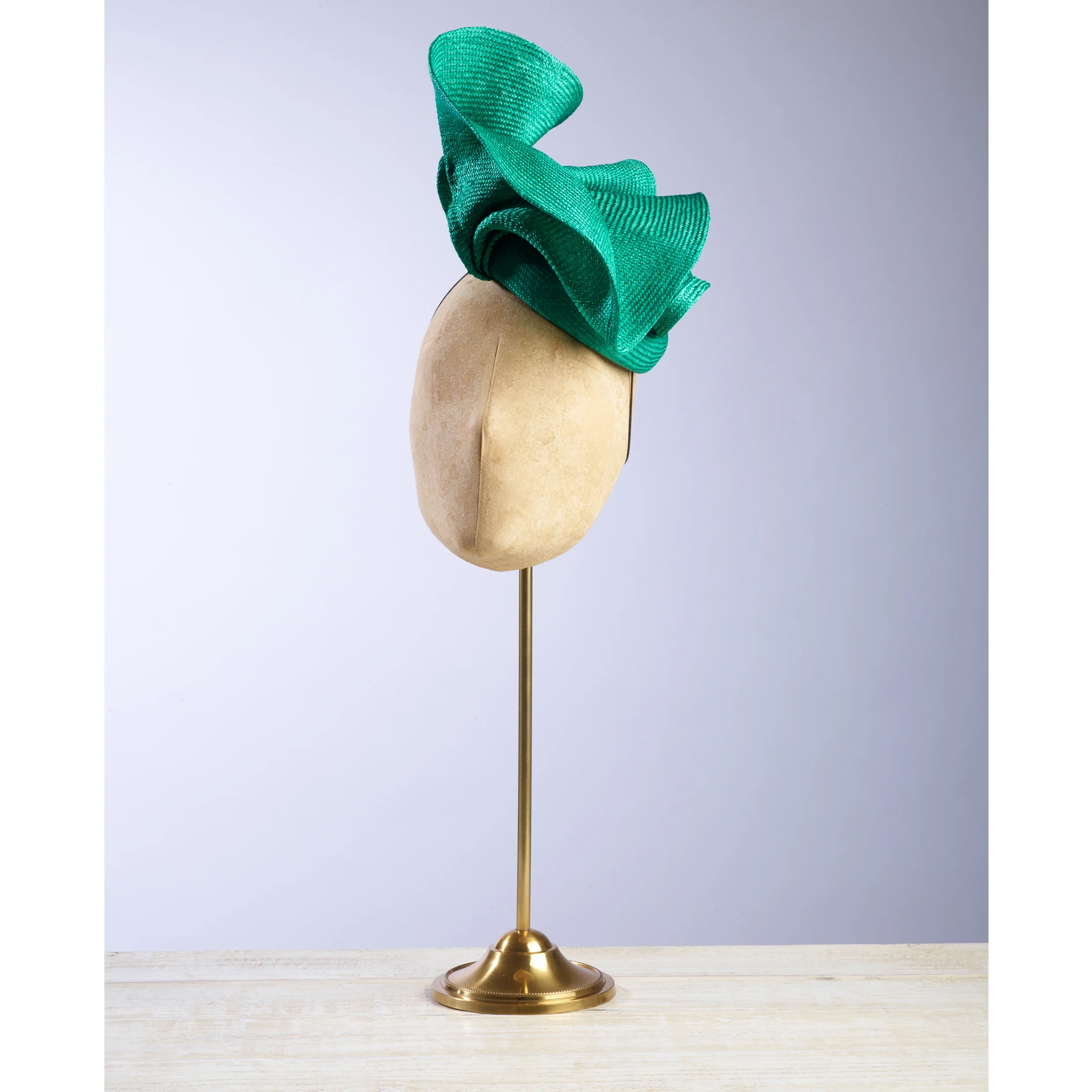 VOLUTE (Green) - £80 Emerald green sisal straw button headpiece with matching structural folds.