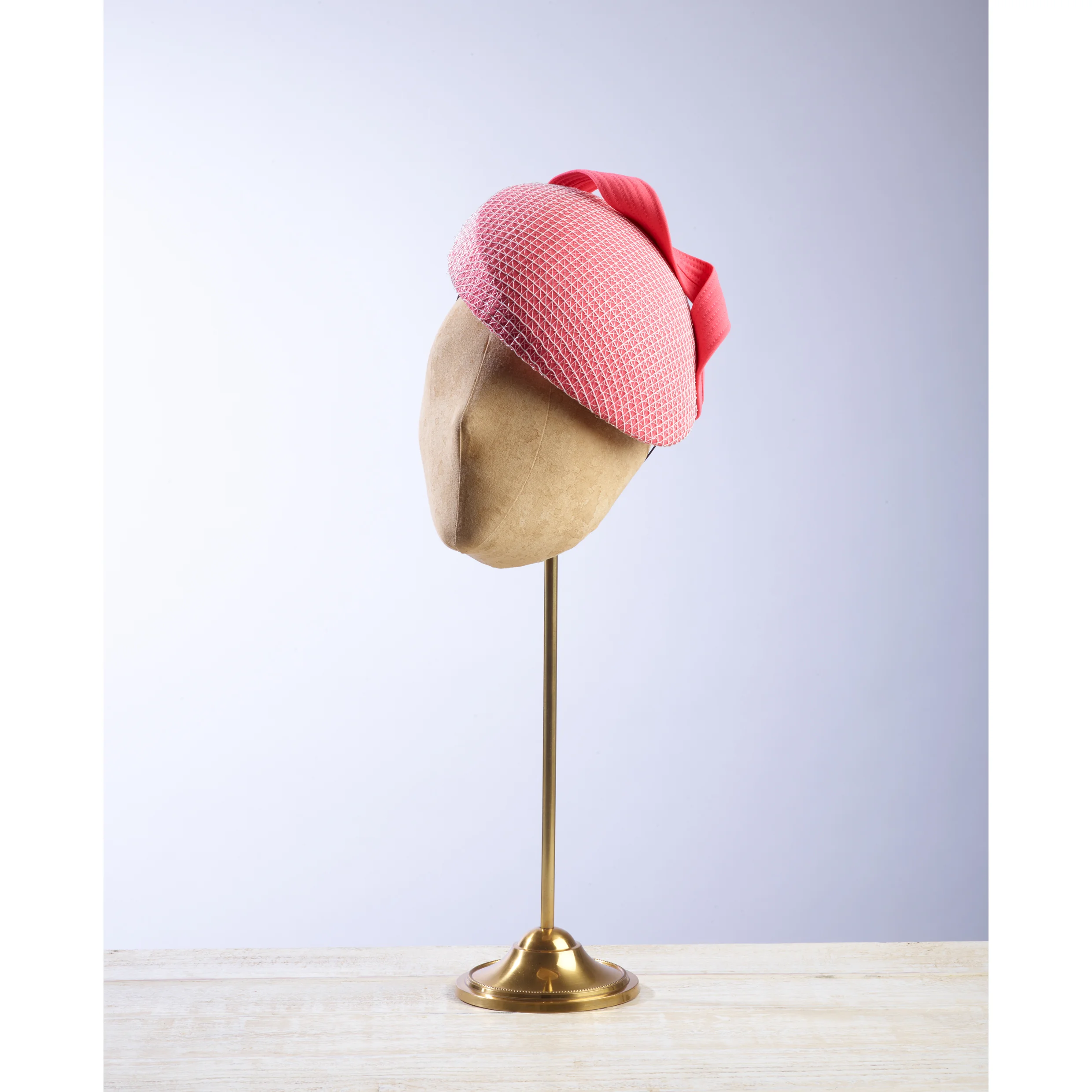 FANLIGHT -£75 Pink fabric beret covered with a white and silver mesh and complimentary twist.