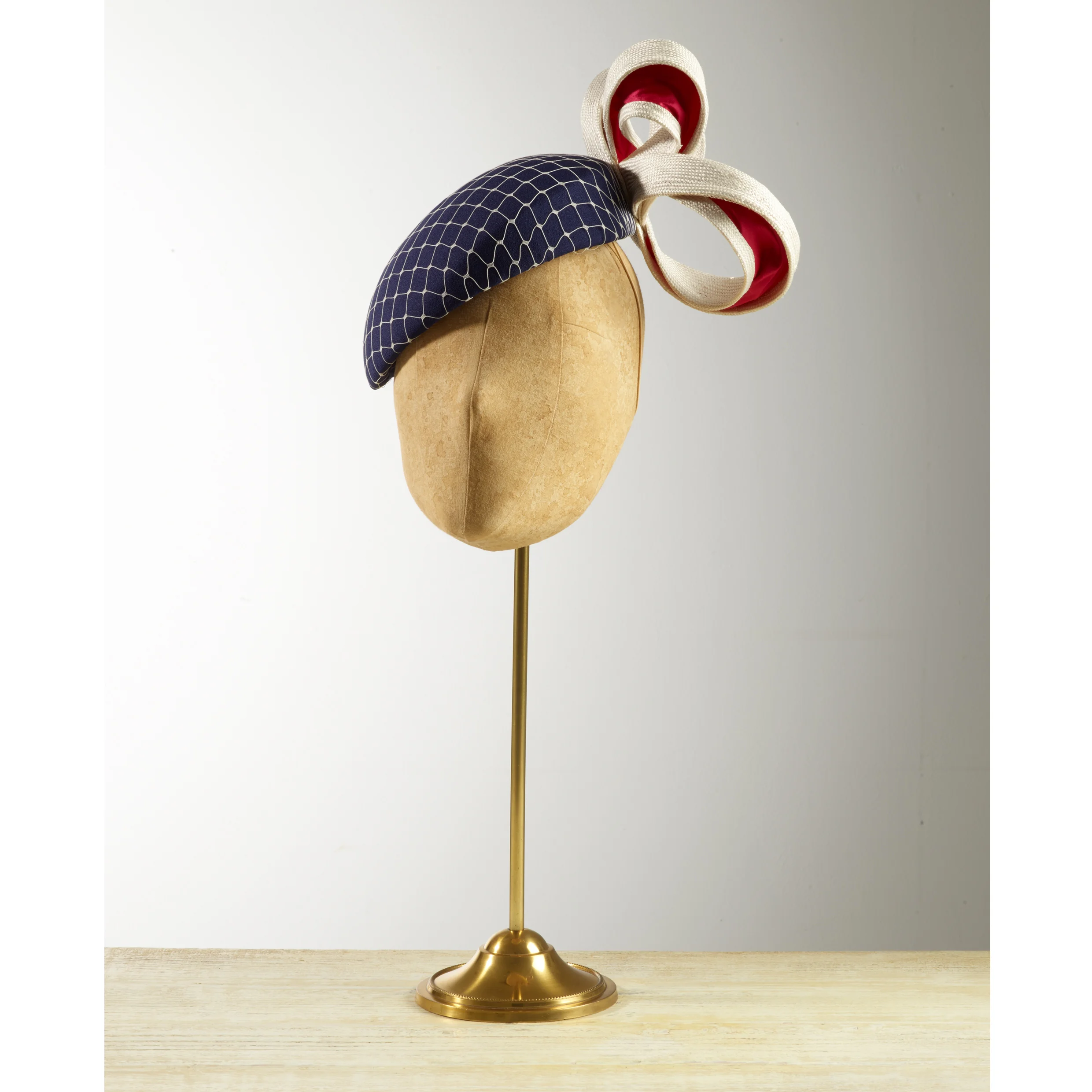 FLYTRAP - £75 Navy silk beret with white veiling and cream sisal straw and silk magenta loops.