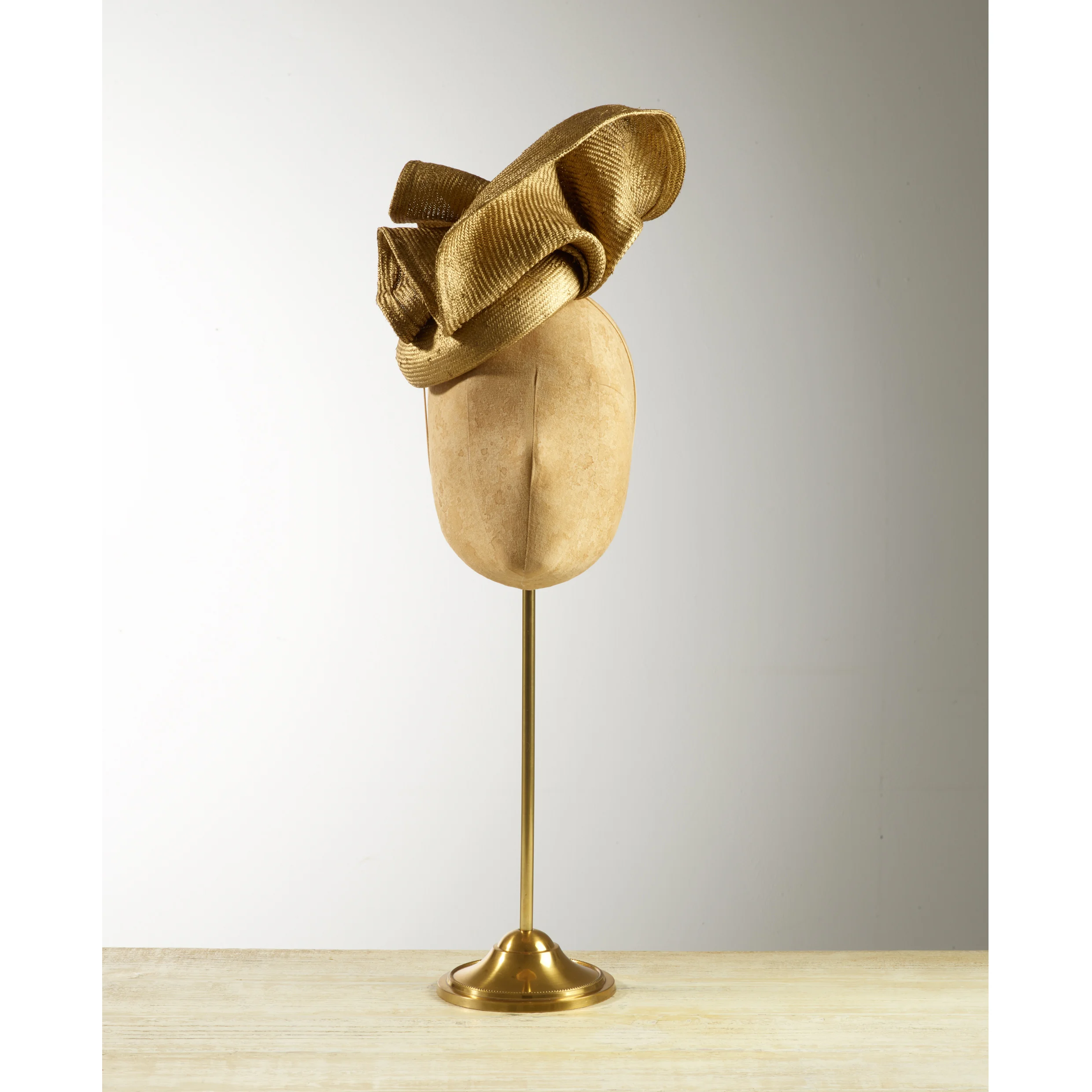 VOLUTE (Gold) - £80 Gold sisal straw button headpiece with matching structural folds.