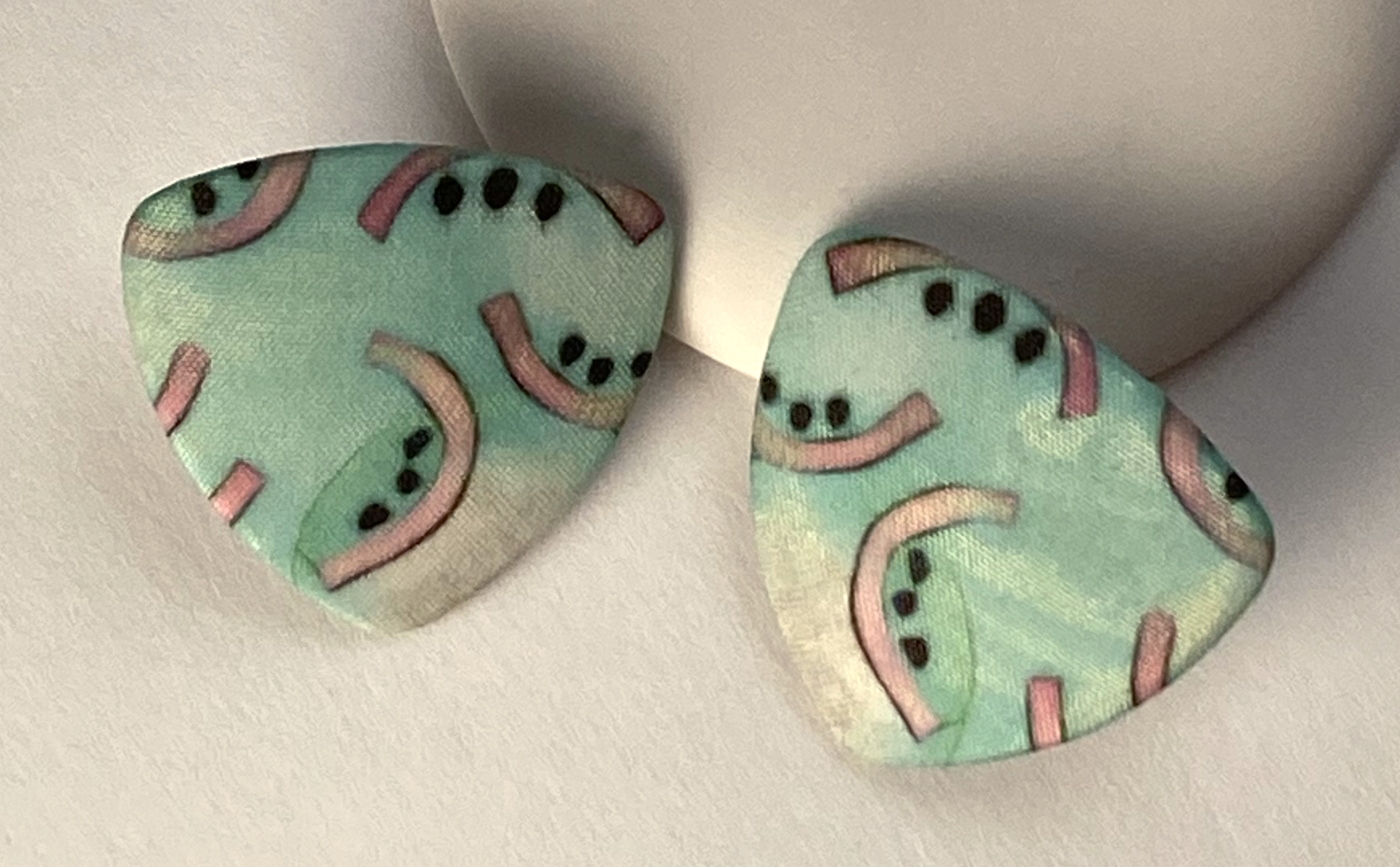 Turquoise Triangles with Watermellons.png