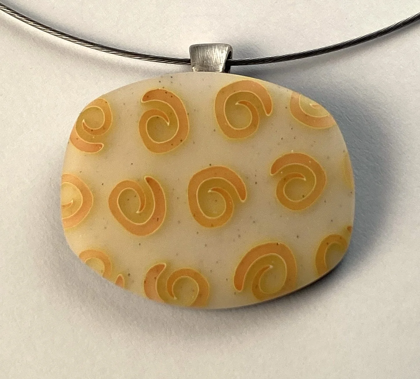 pendant with orange swirls.jpg