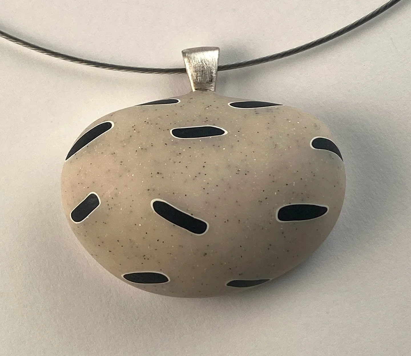 River rock pendant with black ovals.jpg