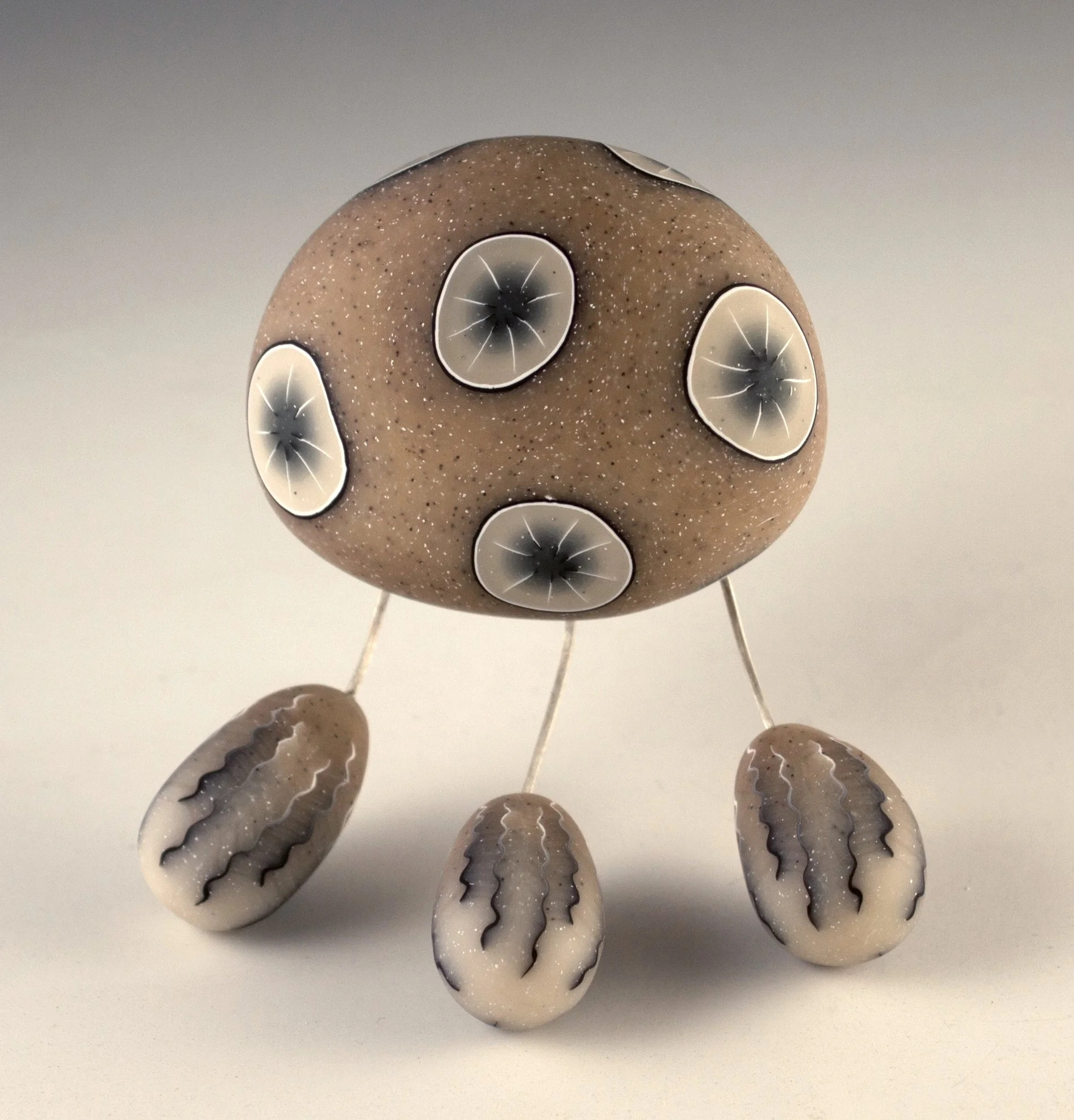 Brooch with Legs in translucent browns.jpg