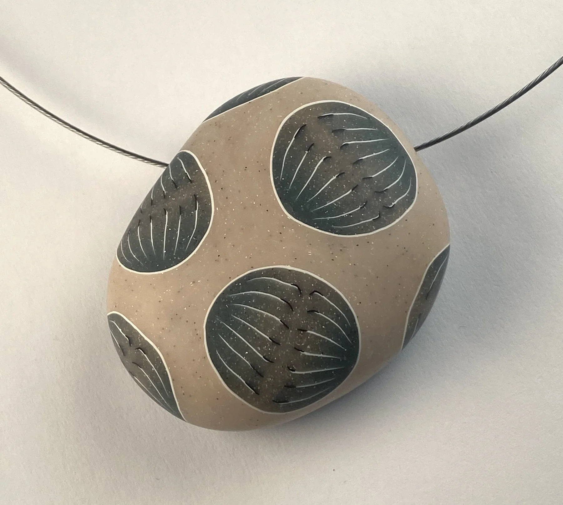 Mitosis river rock pendant.jpg