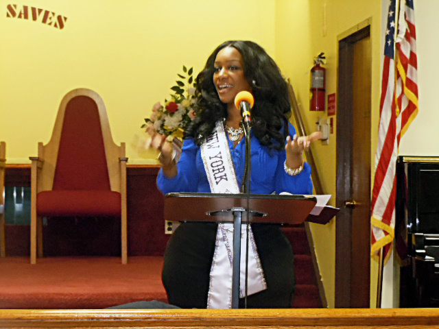 Emicia performing spoken word in January of 2014