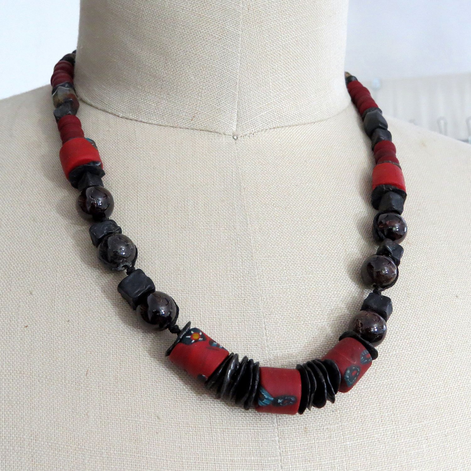 dragon skin steel discs, cubes and nuggets, vintage Venetian glass, jumbo garnet rounds, black jade, glass trade beads on nylon cord