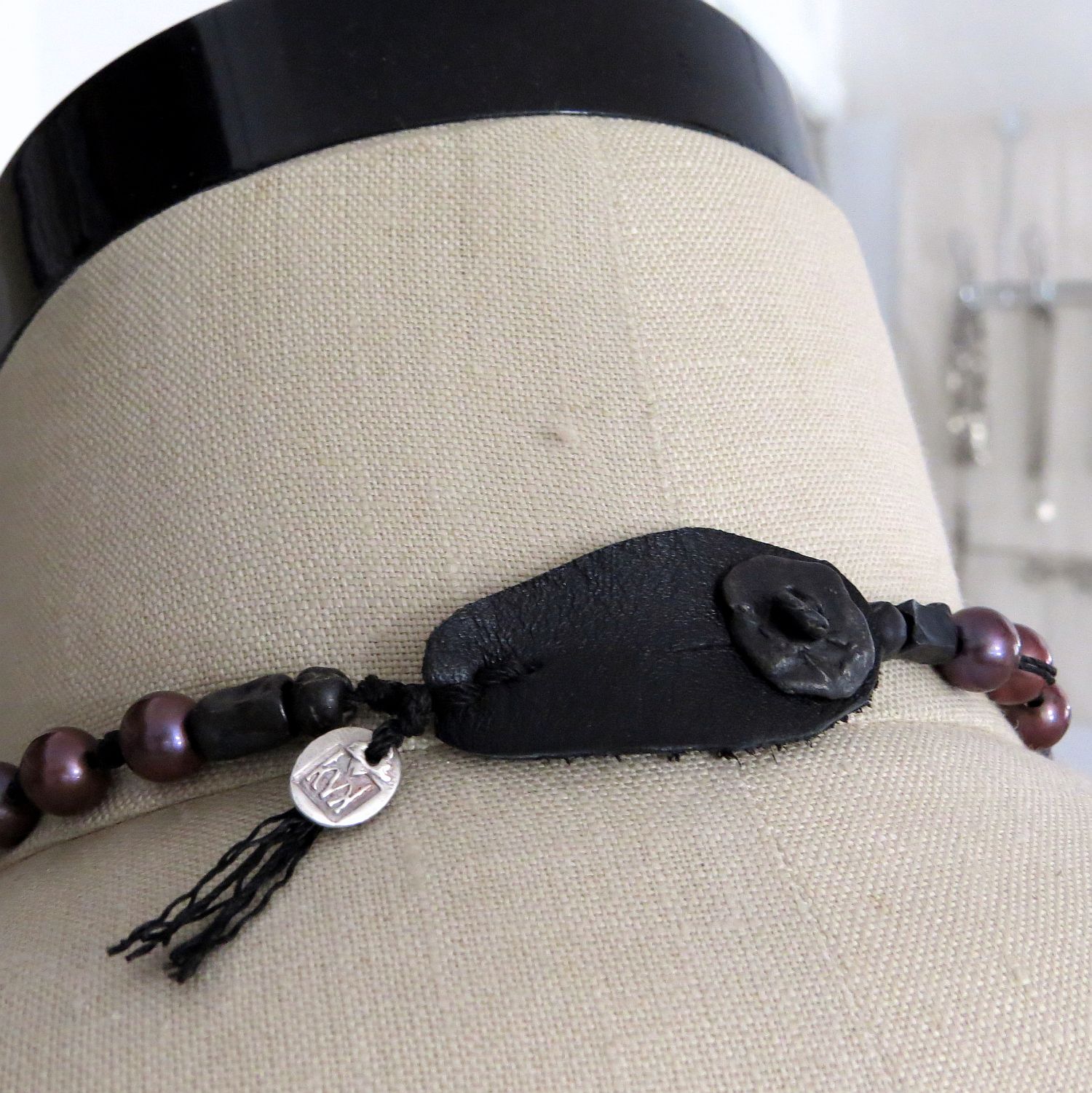 and leather seems to be playing a nice supporting role in the new work ... oh and there's freshwater pearls as well