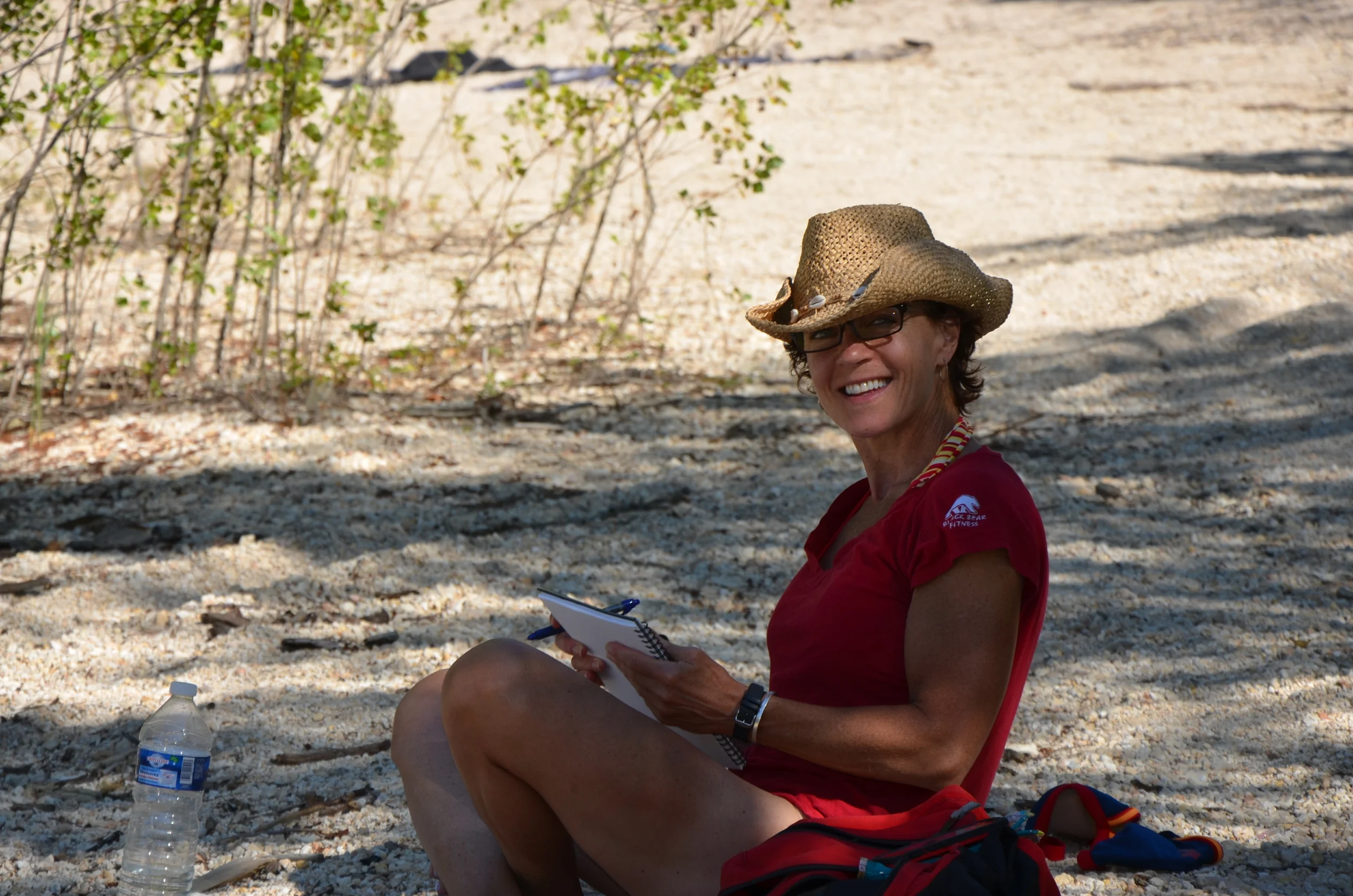 Laura really does stop and chill. Here she is, journalling in France and in the shade at Le Lac du Verdon