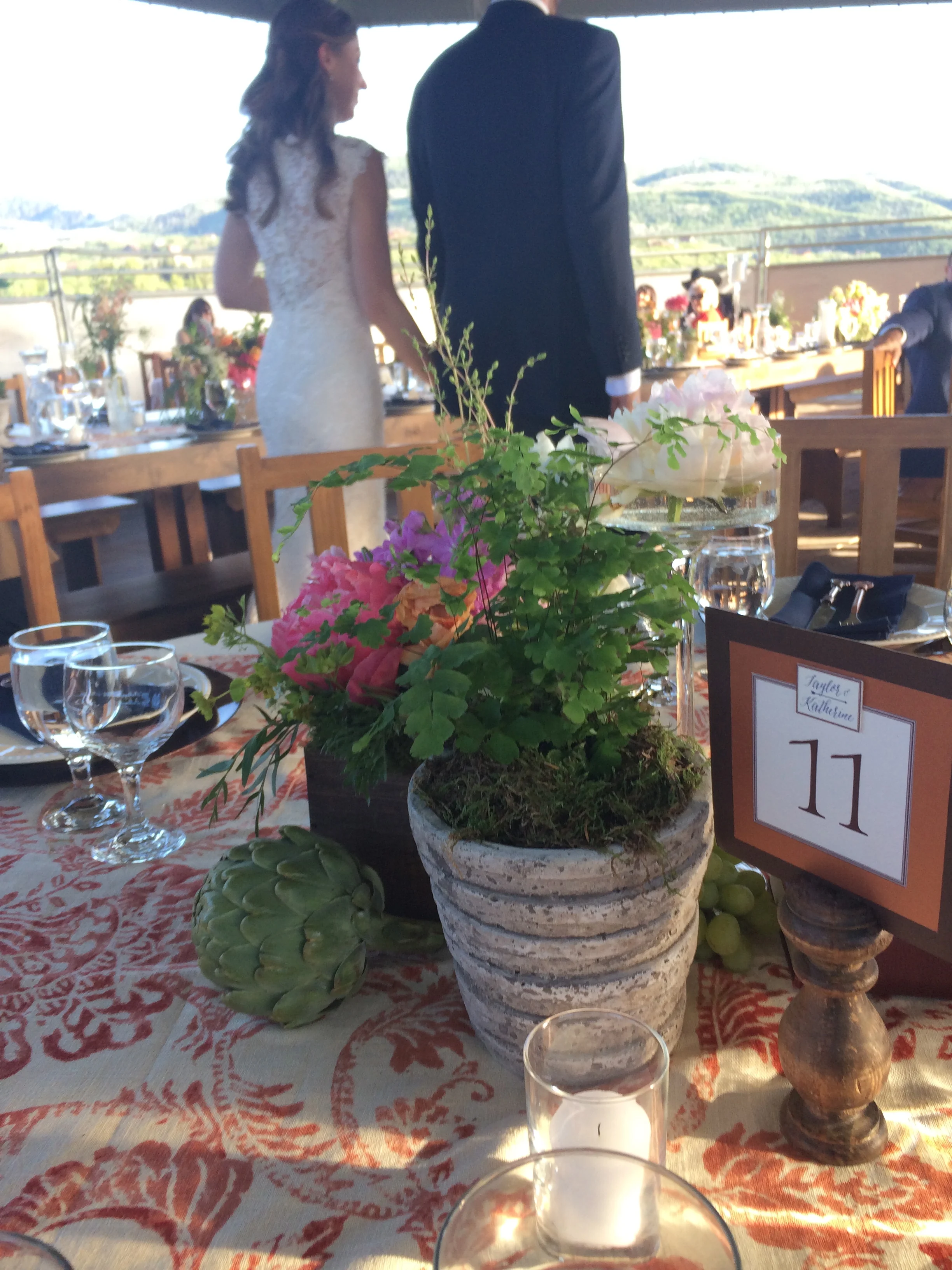 Tablescape (with bride & groom in the background.) 