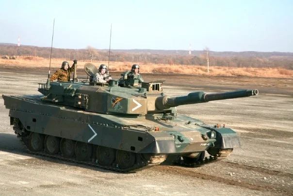 Taking a spin on a Japanese tank with one of my videographers during an exercise on Hokkaido.