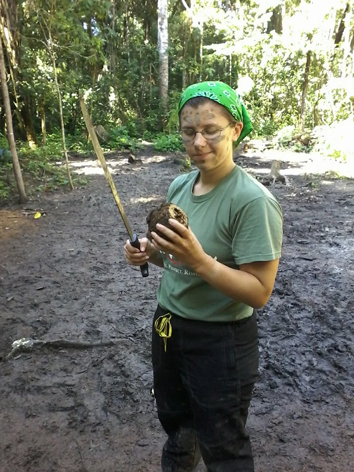 I'm examining a Brazil Nut I tried to open with a machete after a few of us painted our faces with mud for fun. After this picture, I managed to finally get it open! It was a ten minute project.