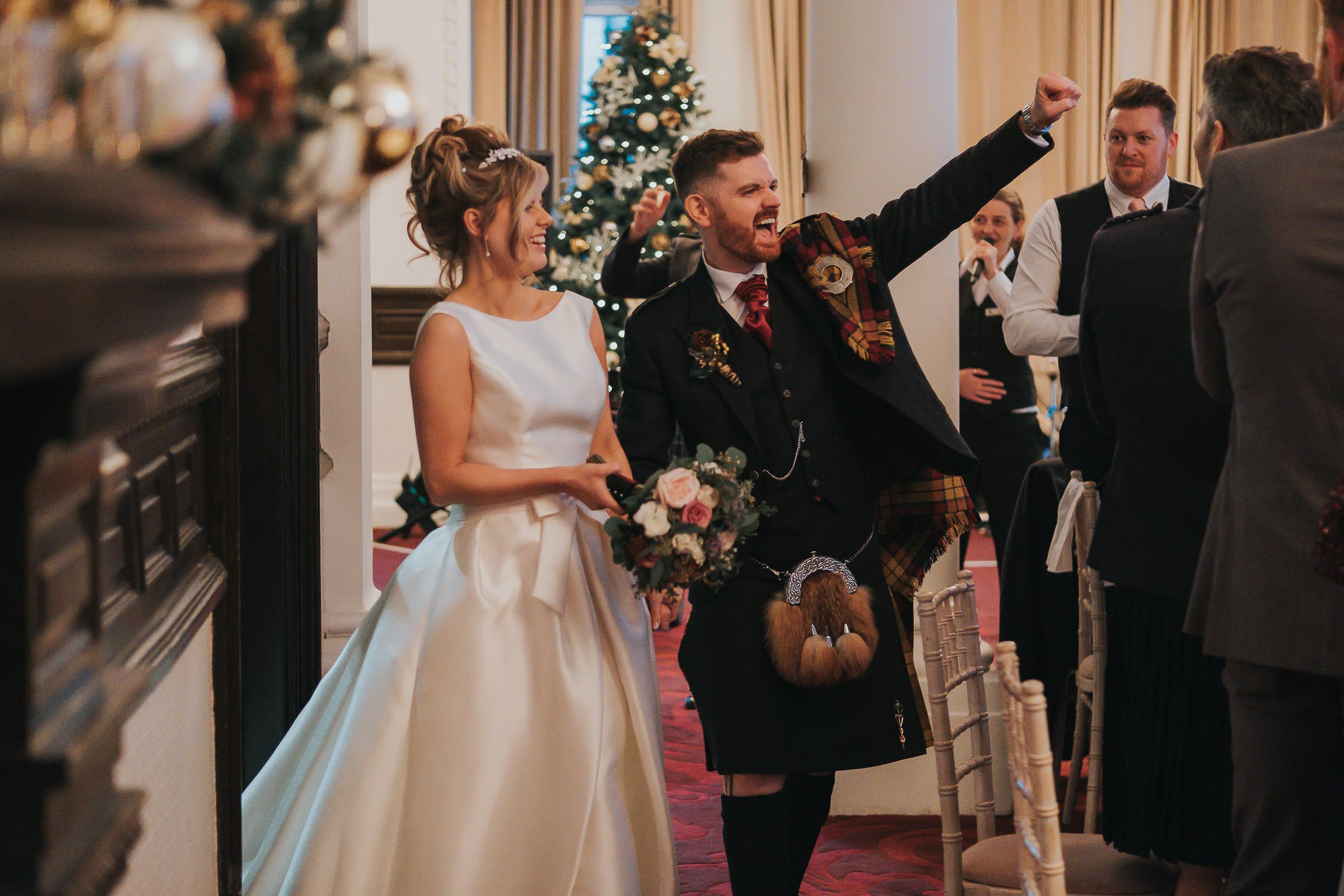 bride and her groom being announced in to their wedding breakfast